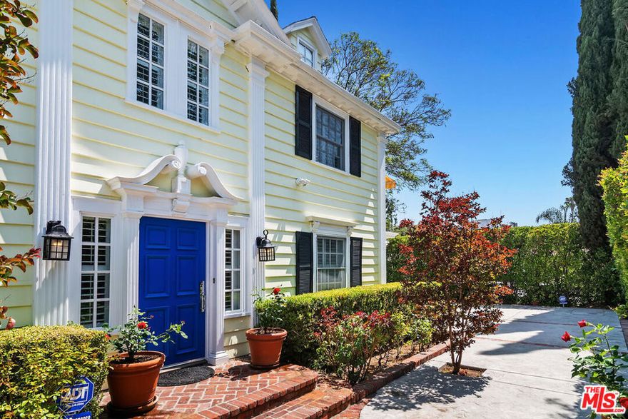 Creative Compound in the Heart of Valley Village - Colonial style home with Private Recording Studio - Tucked away in a private, gated, and secluded compound. This stunning two-story home offers 3 bedrooms and 2 bathrooms, combining classic architecture with modern amenities. Located in the heart of Valley Village, it's just minutes from entertainment, shopping, major freeways, and the Metro line.Step inside to find rich hardwood floors throughout, recessed lighting, and skylights that bring natural light into the upstairs bedrooms. The home is pre-wired for sound and media, making it perfect for modern living.The chef's kitchen is fully equipped with top-of-the-line appliances, including a Sub-Zero refrigerator and double ovens, and features a cozy breakfast nook that doubles as a convenient work-from-home space. Adjacent to the kitchen, the formal dining room overlooks the beautiful backyard.All windows have been upgraded to energy-efficient double-pane glass with elegant wooden shutters.What truly sets this property apart is the professionally designed, soundproof studio space. The 3-car garage has been converted into a high-performance creative hubideal for composers, producers, podcasters, editors, and performers. Featuring a 5.1 surround sound setup, separate live and control rooms wired with premium Mogami cabling, and a private entrance with its own bathroom and lofted storagethis is a rare turnkey opportunity for content creation, post-production, or immersive home theater.Originally built by and for a working film/TV composer, this space is dialed in for composing, mixing, masteringor anything your imagination requires.A true sanctuary for artists and visionaries alike.