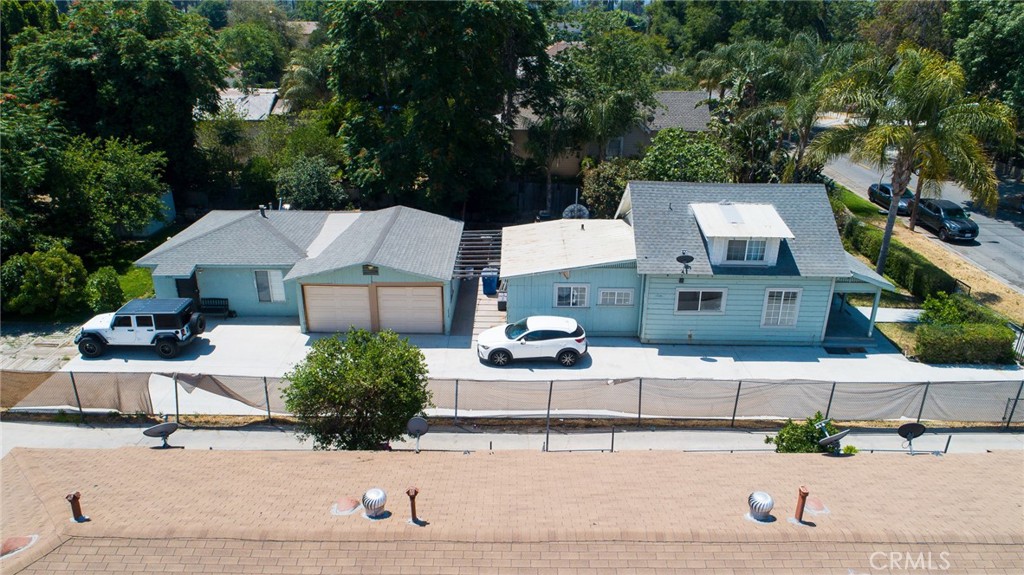 Exceptional Riverside INCOME PRODUCING, (Duel Unit/ADU) with Exceptional Expansion Potential – Just 1.3 Miles from UCR! Whether you're a savvy investor, a first-time homebuyer, or someone looking for a smart multi-generational living solution, this versatile 4-bedroom, 2-bathroom(3/1 & 1/1) duel unit/multi family with TONS of parking is a rare gem in the heart of Riverside. Perfectly positioned just 3 miles from the University of California, Riverside, this property offers both convenience and long-term value. Each unit features bright, spacious interiors, modern and updated kitchens and baths, and a flexible layout ideal for families, roommates, or renters. The main house is also equipt with a standing space cellar under the home as well as a beautiful covered porch for those warm summer nights. The lush, beautifully maintained individual yards create a private outdoor oasis for both units providing ample family space for both properties, while the secure perimeter fence provides added safety and peace of mind for residents, children, and pets alike. Investors, take note: This property is fully approved for a third unit, and the foundation has already been poured—saving you time, money, and red tape. The property also has a large 2 car garage that also could potentially be converted into a 4th unit. Expand your portfolio, stack your doors or create additional living space for the In-Laws with ease. Dont miss this special opportunity Located near schools, shopping, dining, and major freeways, this is a prime Riverside location with strong rental demand and future growth potential. Live in one, rent the other, or build out your investment vision—this property is ready for your next move.