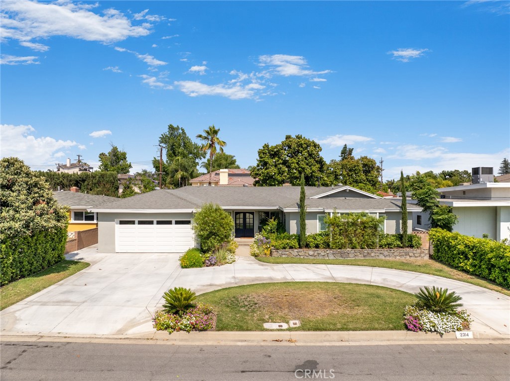Welcome to this renovated single-story home!! nestled on a quiet street in Arcadia. This stunning home features a great curb appeal with a beautiful circular driveway. Step inside the double door entry to discover flawlessly remodeled modern amenities that harmonize with timeless design. With 3 bedrooms and 2.5 bathrooms, including a luxurious master suite, this home offers 2123 sq ft on a 9161 sq ft lot for comfortable living. Two attached car garage with opener adds convenience and security with direct access from the kitchen, easy to park and bring groceries in. Every corner of this home has been rejuvenated, large windows throughout the home fill with natural light while offering picturesque views of the beautiful outdoor pool. The formal living room features a cozy fireplace and specious dining area. The updated kitchen, embrace the updated quartz countertops including stainless steel appliances, refrigerator, stove, dishwasher, sink as well as all modern fixtures throughout. Step outside to a backyard paradise featuring a large pool that sets the tone for the elegance within, a perfect outdoor retreat for relaxing or family gatherings. Conveniently located near top-rated schools, parks, shopping, and dining. This beautiful renovated home is a rare find. Don't miss this incredible opportunity!