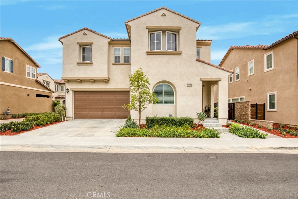 Situated within the prestigious guard-gated community of The Canyons, this thoughtfully crafted home perfectly combines sophistication with everyday comfort. The open and airy floor plan showcases a spacious great room and a modern chef’s kitchen appointed with quartz countertops, an expansive center island, premium stainless-steel appliances, and extensive cabinetry. A guest bedroom and full bath on the main level offer ideal accommodations for visitors or multi-generational living. Upstairs, a versatile loft provides the perfect space for a home office or media lounge, while the luxurious primary suite boasts a spa-inspired bathroom and an oversized walk-in closet. Two additional bedrooms and a convenient laundry room complete the second level. Designed for both relaxation and entertaining, the private backyard offers the perfect outdoor retreat. Residents of The Canyons enjoy resort-style amenities including a clubhouse, pool, spa, cabanas, BBQ area, splash pad, and 24-hour security. With solar panels, top-rated schools, scenic trails, upscale shopping, fine dining, and easy freeway access just minutes away, this home offers elevated living in one of Porter Ranch’s most sought-after communities.