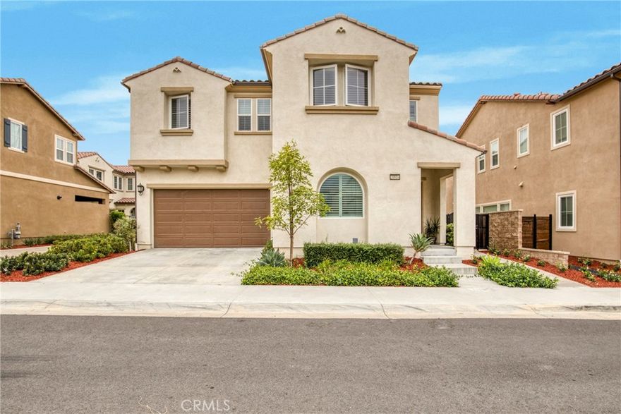 Situated within the prestigious guard-gated community of The Canyons, this thoughtfully crafted home perfectly combines sophistication with everyday comfort. The open and airy floor plan showcases a spacious great room and a modern chef’s kitchen appointed with quartz countertops, an expansive center island, premium stainless-steel appliances, and extensive cabinetry. A guest bedroom and full bath on the main level offer ideal accommodations for visitors or multi-generational living. Upstairs, a versatile loft provides the perfect space for a home office or media lounge, while the luxurious primary suite boasts a spa-inspired bathroom and an oversized walk-in closet. Two additional bedrooms and a convenient laundry room complete the second level. Designed for both relaxation and entertaining, the private backyard offers the perfect outdoor retreat. Residents of The Canyons enjoy resort-style amenities including a clubhouse, pool, spa, cabanas, BBQ area, splash pad, and 24-hour security. With solar panels, top-rated schools, scenic trails, upscale shopping, fine dining, and easy freeway access just minutes away, this home offers elevated living in one of Porter Ranch’s most sought-after communities.