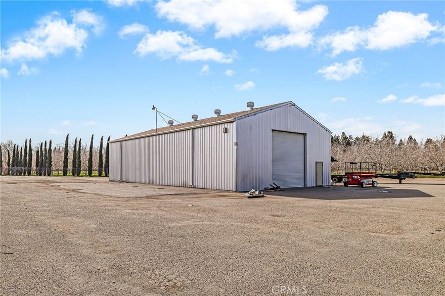 Warehouse building with 2.6 acres +/- of fully fenced and paved yard space. Great location with easy access right off Hwy 99.
