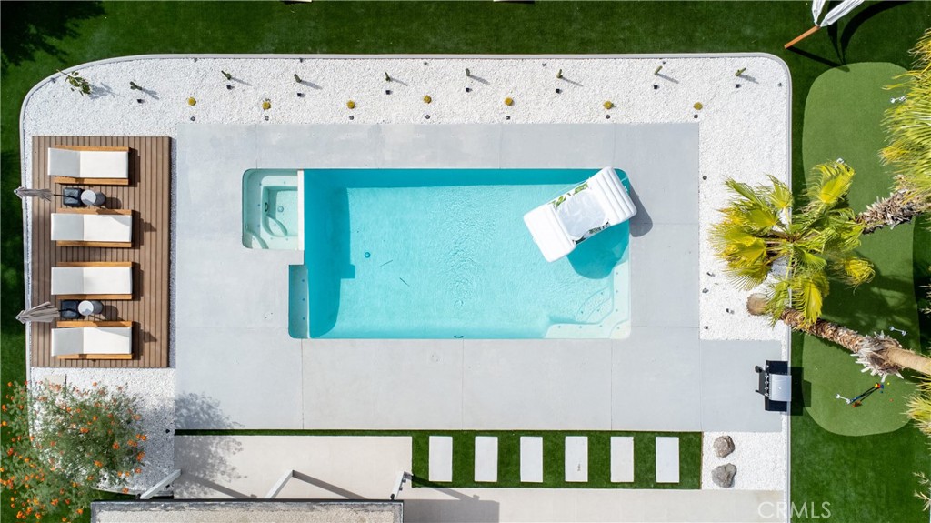 Welcome to 515 N Burton Way, your private oasis in the charming Oasis Del Sol neighborhood. Soak in the desert sun, mountain views, and stunning California sunsets from a backyard designed for relaxation—featuring a sparkling heated pool and spa, a spacious terrace with a 20-foot floating deck, cozy fire pit table, and two hammocks overlooking 2,100 sq ft of brand-new artificial turf. A 4-hole putting green adds a playful touch to this already impressive outdoor space.
Inside, the home blends Bali/Cabo and Mid-Century inspiration with modern comfort. The newly remodeled kitchen features a quartz waterfall island, sleek appliances, and thoughtful details throughout—including a Nespresso machine with complimentary pods, sugar, creamer, and stir sticks. The open layout connects the kitchen to a bright and inviting living area, perfect for relaxing or entertaining.
There are three beautifully furnished bedrooms and two updated bathrooms, all designed with comfort and style in mind. The living room includes a 75” Samsung Smart TV, while the primary bedroom is equipped with a 50” Roku TV. Stay cool with the Nest thermostat and enjoy modern finishes throughout.
A two-car garage, additional driveway parking, and street parking allow for plenty of space for you and your guests. And when it comes to location, it doesn’t get more convenient—you're less than five minutes from Palm Springs International Airport and downtown Palm Springs, with its vibrant restaurants, bars, shops, and the Agua Caliente Casino. Festival-goers will love being just minutes from shuttle stops for Coachella and Stagecoach, making it an easy and stress-free ride to the Empire Polo Grounds.
Perfectly situated for both relaxation and exploration, this home places you just over a mile from the Palm Springs Convention Center, a short drive to the iconic Palm Springs Aerial Tramway, and within easy reach of Agua Caliente Rancho Mirage, The Living Desert Zoo and Gardens, and even Joshua Tree National Park, just 42 miles away. Whether you're seeking a peaceful retreat or a vibrant social getaway, this property delivers the ideal blend of desert charm, modern luxury, and unbeatable convenience.