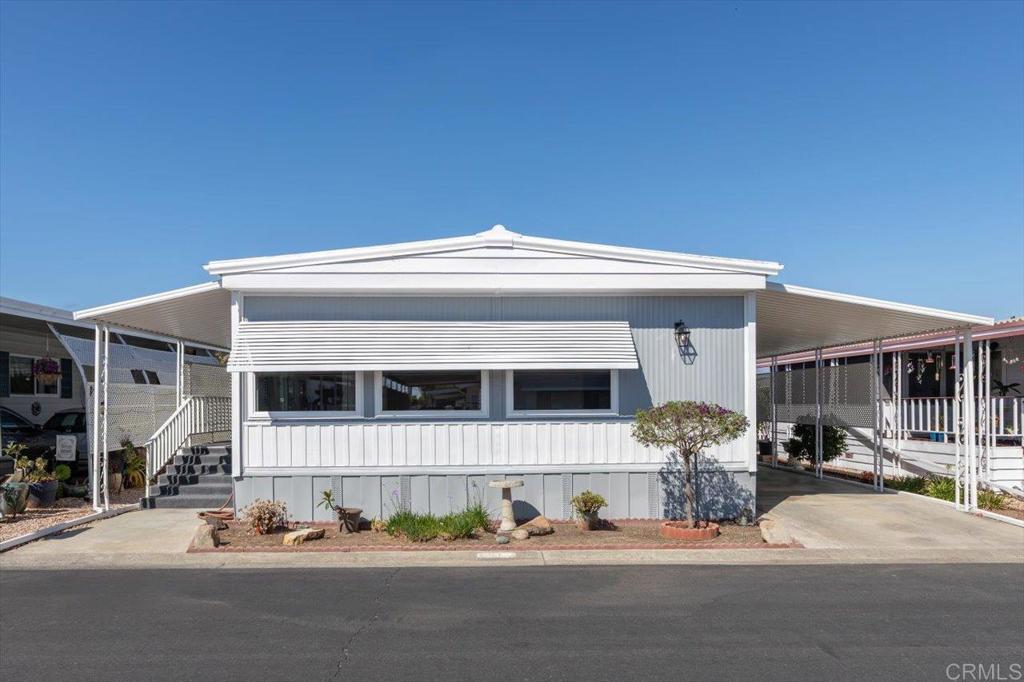 Recently refurbished home. Vinyl plank flooring throughout upgraded appliances paint . Bookcase in the living area adds a great feature for storage and to display cherished keepsakes. Bright open floorplan lighter wood flooring. Large side porch new carpet indoor outdoor. This porch has generous outdoor living space.