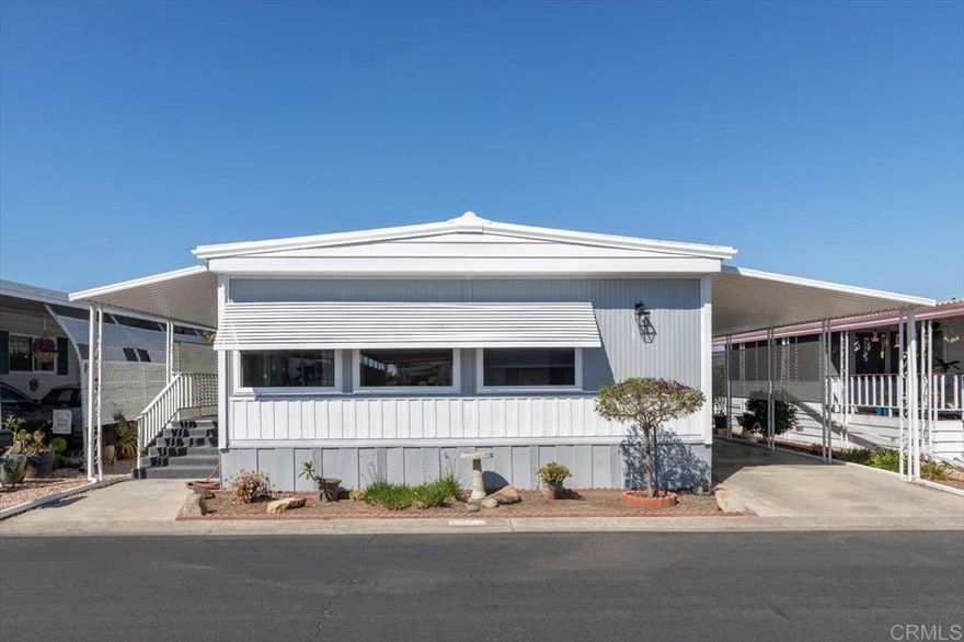 Recently refurbished home.  Vinyl plank flooring throughout upgraded appliances  paint .  Bookcase in the living area adds a great feature for storage and to display cherished keepsakes.  Bright open floorplan lighter wood flooring.  Large side porch new carpet indoor outdoor.  This porch has generous outdoor living space.