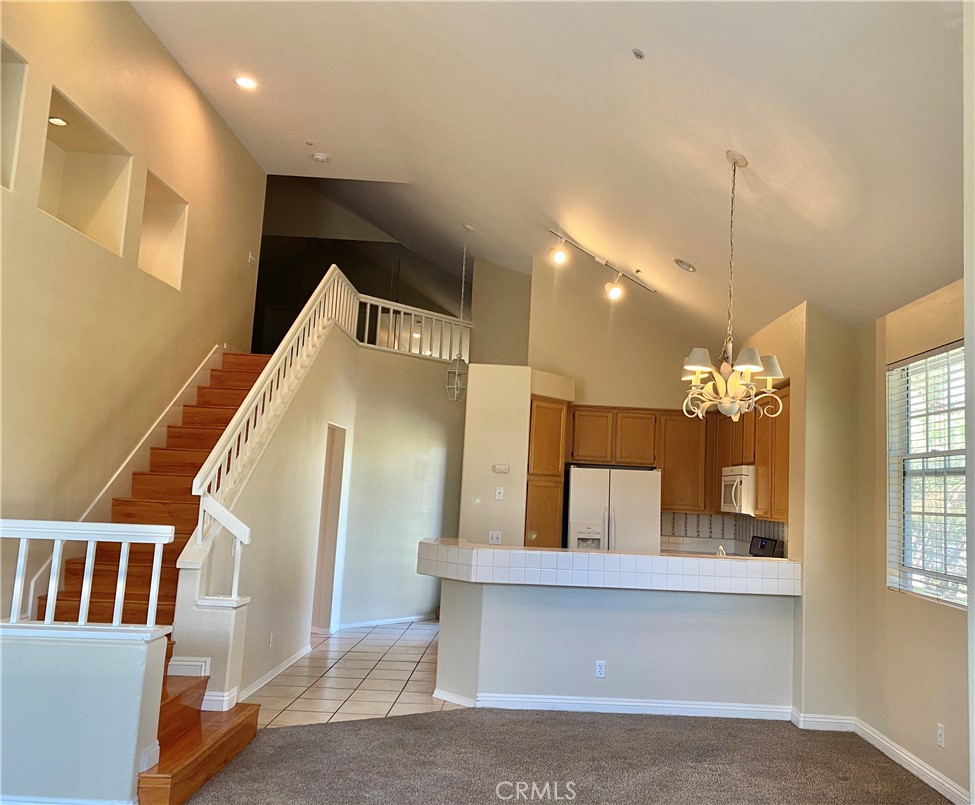 Enjoy resort style living, two levels newer upgraded home in Market Place/Tustin Ranch, street corner, high ceilings, new paint, clean light and bright, 2 br/2 ba + an extra big loft which can be the 3rd bedroom + office, full loft with a full staircase (not a spiral stair), upstairs with a big recreation/office area & additional bedding area & a walk-in closet, entrance with high vaulted ceilings, distinctive fireplace in living room, separate dining area, open kitchen with breakfast bar, dishwasher, range and microwave, refrigerator, washer & dryer included, master bedroom with his and hers closets, guest bedroom with a big walk-in closest, 2 spacious balconies with panoramic unobstructed views, 1 car garage (with storage shelf) with remote access, plus 1 assigned carport space, plenty of guest parking, large association pool with 2 spas and 3 bar-be-que units, close to a myriad of options for dining, shopping, entertainment, recreation, golfing and commuting. Tustin schools beat the state and national education level.