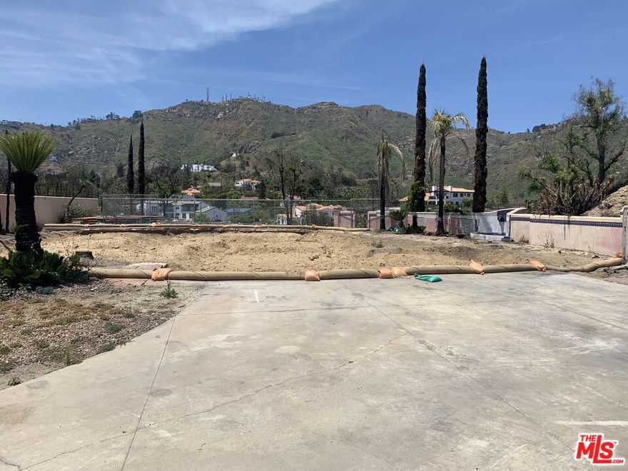 This half acre Malibu Parcel is a Palisades Fire rebuild and includes a pool, canyon and ocean views. The home consisted of 4 bedrooms and 3 bathrooms with 4,287 sq. ft. (per public records). Bring your developers or build your dream home. Located in the desirable Sea View Estates this home is approx. 10 to 12 minutes from pch. The property boundary portrayed in the images is only an approximation buyer is advised to perform a survey.