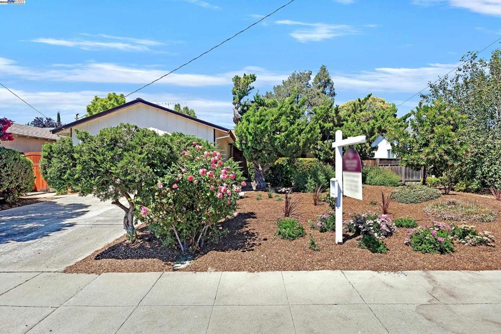 Charming 3-Bedroom Home with Timeless Appeal. Welcome to this well-maintained 3-bedroom, 2-bathroom home situated on a 6,000 sq ft lot. Offering 1,196 sq ft of comfortable living space, this inviting residence blends classic charm with thoughtful care in a desirable neighborhood. Inside, you’ll find a bright and airy layout with expansive windows, original hardwood flooring, for both daily living and entertaining. The kitchen features well-preserved cabinetry, solid surface countertops, and a cozy dining nook, providing a warm and functional heart of the home. The primary suite serves as a peaceful retreat. Two additional bedrooms offer versatility for family, guests, or a home office. Both bathrooms are clean, functional, and have been well cared for. Step outside to enjoy a private backyard with mature landscaping, a spacious patio—perfect for relaxing, entertaining, or gardening. Additional highlights include a laundry area in the garage, central heating & air, and an attached 2-garage with driveway parking.