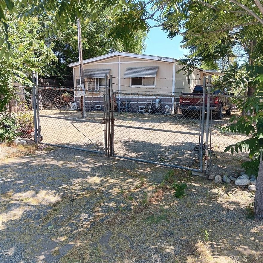 Investors wanted!  Manufactured home on nearly a half acre lot. Great location in the city of Perris near the Riverside border. Home features two bedrooms and two baths plus a living room, kitchen and dining area. Looking for an investor who will keep long term tenants in place.