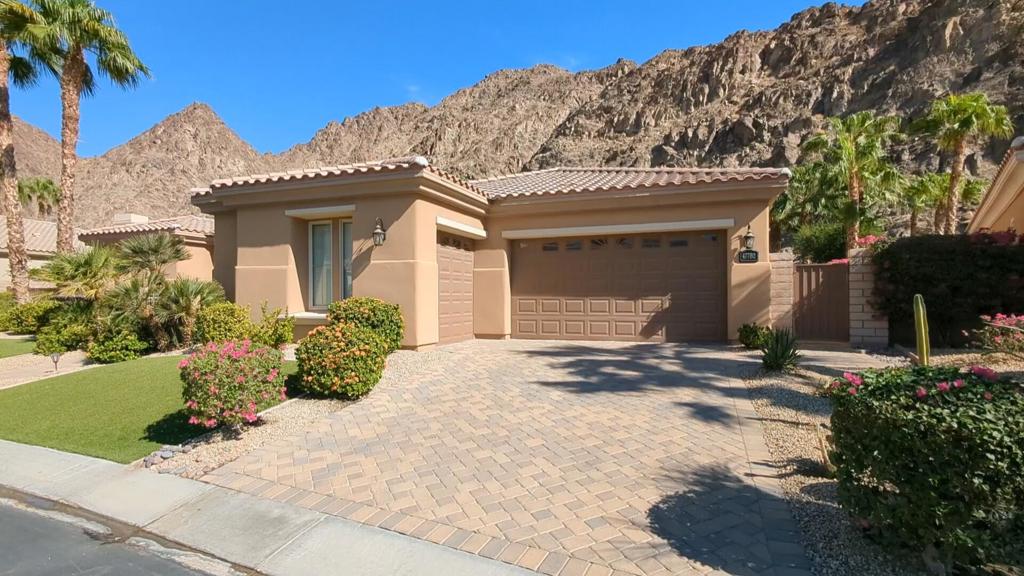 (NOV. 15, 2025 - MAR. 31, 2026 BOOKED) All other months are available! Call for price and availability. Step into a realm of serene luxury in this impeccably designed haven offering 3186 square feet of crafted space. Unleash your inner chef with the sleek, stainless steel appliances and wooden flooring that span across a spacious great room and inviting bedrooms. Host grand gatherings or intimate dinners in the formal dining room or breakfast nook, each framing beautiful vistas. The primary bedroom suite is a true retreat, complemented by mesmerizing mountain views and access to a secluded covered patio. Pamper yourself in the ensuite bath with dual vanities, travertine finishes, and both a tub and a separate shower. The home's configuration ensures privacy, with two additional ensuite guest bedrooms located at the opposite end--perfect for family or visitors. Outside, the custom pool and spa beckon for relaxation, surrounded by multiple sitting and dining areas. For a tranquil end to your day, the cozy courtyard and stone decking provide a picturesque spot to watch the evening skies blush. Positioned near top schools, shopping centers, and parks, this home is more than just a living space--it's a lifestyle waiting to be embraced.