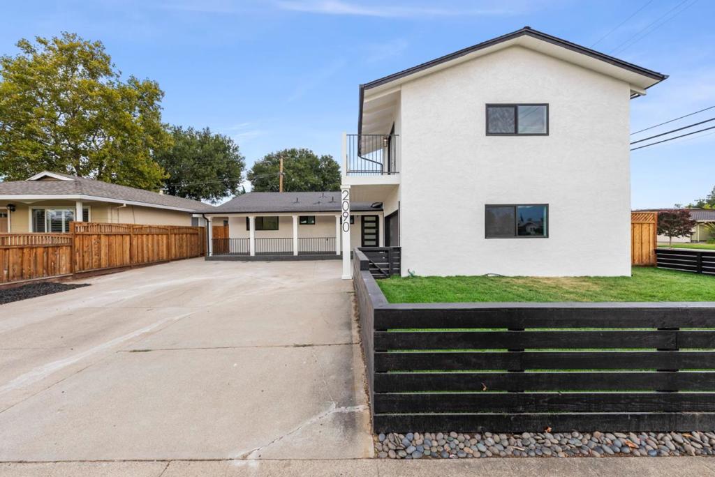 Welcome to this beautifully remodeled, like-new residence in one of the areas most desirable neighborhoods, known for its top-rated schools and friendly community. Every detail has been thoughtfully updated, offering the perfect blend of modern style and everyday comfort. This spacious 4-bedroom, 3-bathroom home features two primary suites, ideal for multi-generational living, a guest retreat, or a luxurious private office space. The open-concept layout flows seamlessly from the bright, airy living room into the brand-new kitchen with designer finishes, stainless steel appliances, and elegant countertops. Upstairs and downstairs primary bedrooms provide flexibility, while remodeled bathrooms showcase sleek tile work, updated fixtures, and spa-inspired touches. The home is move-in ready with fresh paint, new flooring throughout, and energy-efficient upgrades. Outside, enjoy a low-maintenance yard with room for entertaining, gardening, or play. Conveniently located near the Westgate shopping center, dining, and commuter routes, this home checks all the boxes and is the turnkey home youve been waiting for!