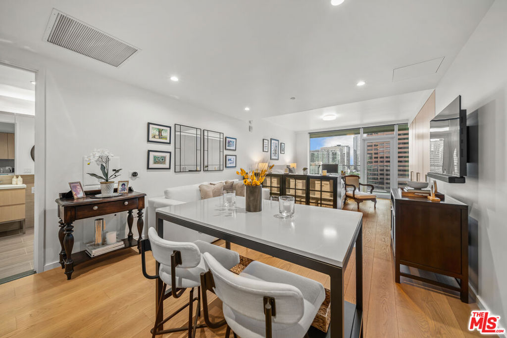 Welcome to Metropolis Tower II Residence #1715, a beautifully designed studio in the heart of Downtown Los Angeles. This 629 sq. ft. home is the largest studio floor plan in the building, featuring an open layout with floor-to-ceiling windows and a private balcony to enjoy sweeping city views. The kitchen and living area flow seamlessly together, creating a bright and versatile space that's perfect for both relaxing and entertaining. Clean modern finishes, generous storage, and a spa-inspired bath give the home a refined yet comfortable feel, while the private balcony extends your living space outdoors. As a resident of Metropolis, you'll enjoy resort-style amenities: 24-hour attended lobby, sky park with pool and cabanas, state-of-the-art fitness center, business center, screening room, and dog park. Secure parking and concierge services make city living effortless. Located just steps from LA Live, Crypto.com Arena, world-class dining, shopping, and entertainment, Residence #1715 sits at the center of DTLA's ongoing transformation. With the city preparing to welcome major global events and continued investment in the area, this home offers not just comfort and style today, but an address with unmatched long-term appeal in one of Los Angeles's most dynamic neighborhoods.
