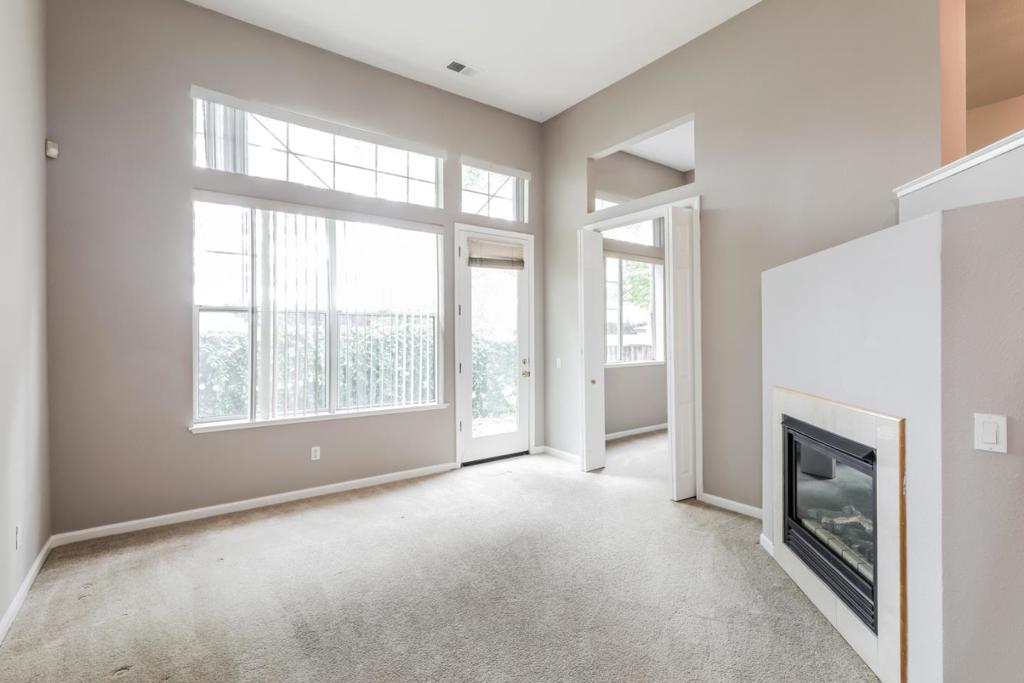 Discover this truly exquisite 3-bedroom, 2.5-bath unit that exudes elegance and comfort! Step into the inviting living room, where towering ceilings and plush carpeting create a luxurious ambiance. The room features a gas fireplace, flooding the space with warmth, while abundant natural light and stunning window views add to its charm. With direct access to the rear yard, families can indulge in outdoor activities and enjoy precious moments together! A versatile bonus room offers endless possibilities. Whether it becomes a playroom, home office, or a personal retreat, the choice is yours! The lofted formal dining area is perfect for sumptuous meals with guests and is adjacent to the kitchen, which boasts expansive cabinetry, cooking appliances, and spacious countertops. Located in the heart of Silicon Valley, you'll enjoy proximity to major tech companies, highways, and the Caltrain for effortless commuting. Immerse yourself in the vibrant neighborhood, with a weekend farmer's market, California Sports Center Swim Complex, outdoor concerts, AMC Theater, and charming pubs. Embrace a dynamic lifestyle with a community center, gym, and library nearby! Schools, parks, supermarkets, and popular restaurants are all within walking distance.