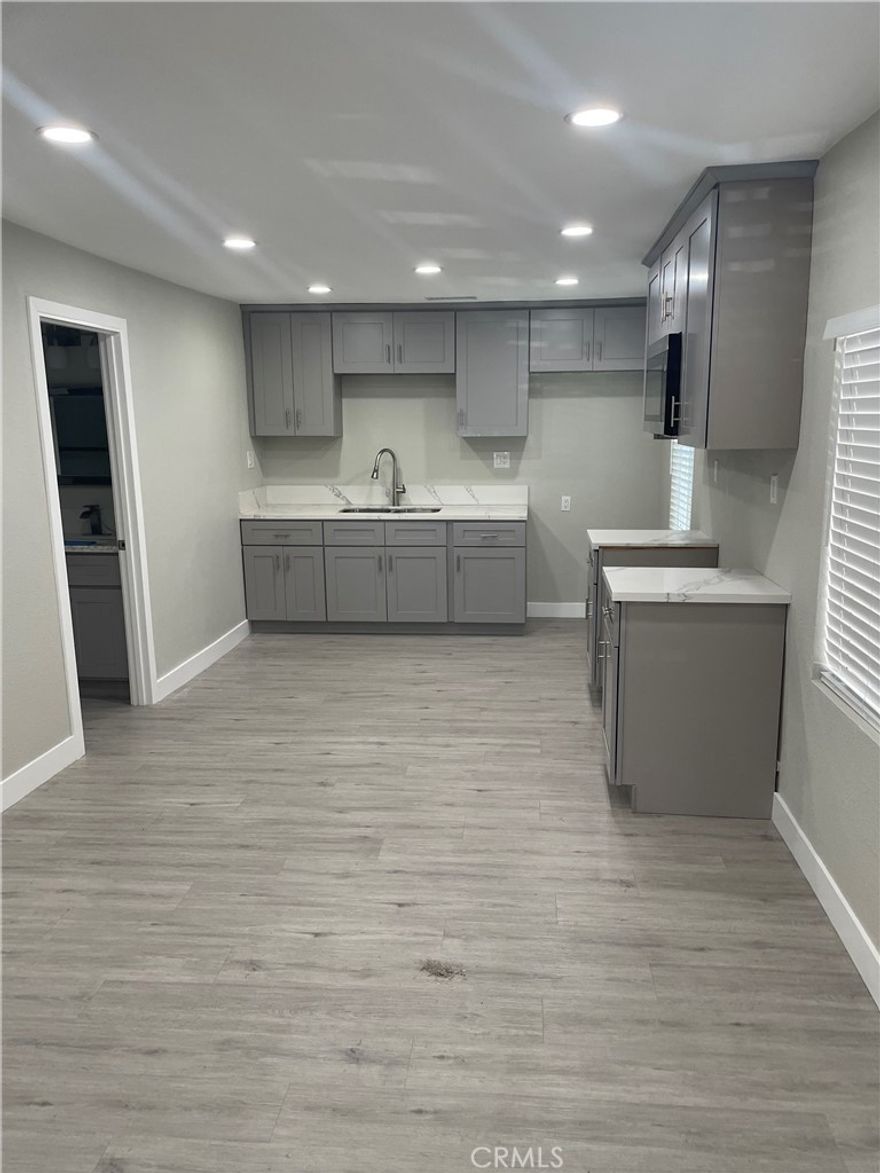 Freshly renovated 2br 2 ba, home with a huge master bedroom with its own beautiful bath, brand new windows, floors, kitchen, new central AC and Heat, washer/dryer hook ups, it has its own electrical and gas meter, open concept owner pays for water and trash, no garage but it has parking 3 regular size cars inside, gated on a cul-de-sac street
