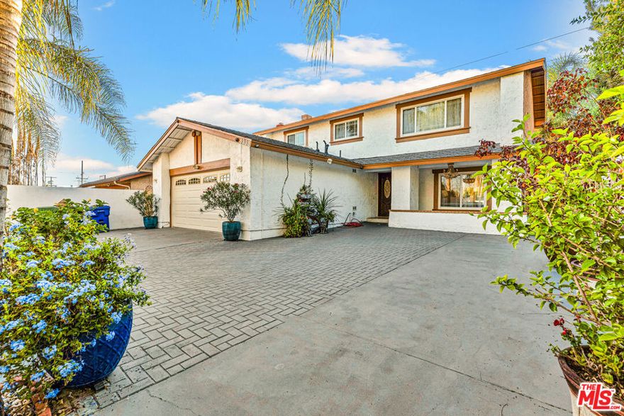 Stunning 4-Bedroom, 3-Bath Northridge Home with Pool! This beautifully appointed 2-story residence offers 2,108 sq ft of living space on a large corner cul-de-sac lot. Interior highlights include a spacious family/dining room with direct access to the yard, separate living room with fireplace, and a bright galley kitchen featuring quartz countertops, tile backsplash, breakfast nook, and pool views. Upstairs you'll find a generous primary suite, 3 additional bedrooms, and a shared bath. Central HVAC plus tile and vinyl flooring throughout for easy maintenance. The private backyard is an entertainer's dream with sparkling pool and plenty of space for outdoor living. Parking for up to 5 cars behind the gate. Conveniently located near shopping, dining, schools, and transit. This home combines comfort, privacy, and lifestyle with incredible upside potential!