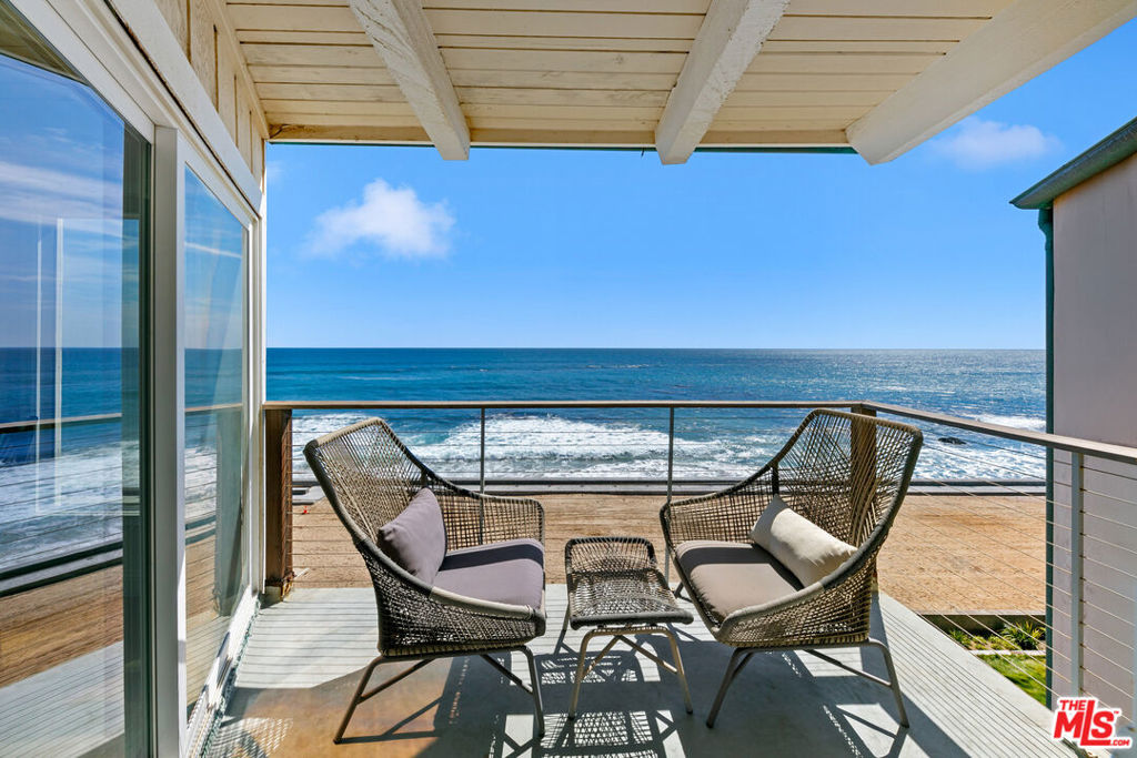 New Oceanfront Lease Listing at Malibu Bay Club! Experience the ultimate Malibu beach lifestyle in this oceanfront gem, set within the exclusive, gated Malibu Bay Club community. Enjoy direct beach access, a resort-style pool, and spa just steps from the sand. This remodeled tri-level Cape Cod masterpiece is designed to capture breathtaking whitewater views at every turn. Inside, espresso hardwood floors flow through sun-filled living spaces, the chef's kitchen features top-of-the-line Viking stove and stainless steel appliances. The living and dining areas open to an ocean-view balcony, perfect for morning coffee or sunset cocktails. Retreat to the stunning oceanfront primary and guest suite, each complete with marble baths and private decks overlooking the Pacific. Cozy up by the wood-burning fireplace, unwind on multiple balconies, and take in endless horizon views. Perfectly positioned near Malibu's iconic surf spots and the legendary Neptune's Net, this home is the definition of coastal lifestyle perfection.