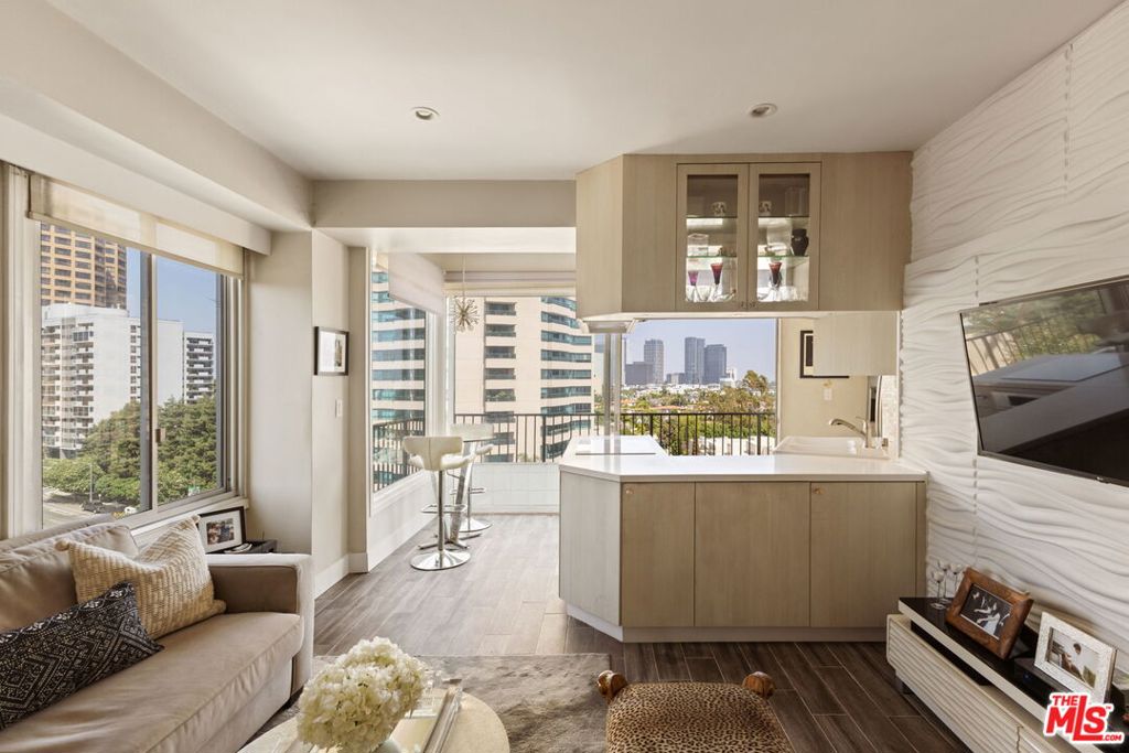 Welcome to one of the most prestigious addresses on the iconic Wilshire Corridor, The Wilshire Regent. This sought-after 10th-floor corner residence offers sweeping, panoramic views from Santa Monica to the Getty, with a front-row seat to the rolling hills of Little Holmby. By night, the city lights come alive, casting a mesmerizing glow from every window. Flooded with natural light, this bright and airy one-bedroom, one-bathroom unit boasts an open-concept layout with stainless steel appliances, farmhouse sink, chic euro bathroom, recessed lighting, and double-pane windows with electronic shades for effortless comfort. The original balcony has been enclosed to create additional interior space, enhancing the home's square footage while showcasing spectacular northwest-facing vistas.Perched above Westwood, just minutes from UCLA, Beverly Hills, and Century City, this location offers unbeatable access to LA's best dining, shopping, and culture. A 15-minute walk to UCLA makes it ideal for students, medical professionals, and commuters alike. Residents of The Wilshire Regent enjoy luxury full-service living with a curated suite of amenities, including: 24-hour concierge and valet parking (for residents and guests), Heated pool, spa, and sun deck, State-of-the-art fitness center, Conference and banquet rooms, Bike storage and EV charging, Common-area laundry on every floor, On-site management. At only $150.00 a night, the building also features exclusive guest suites available only to residents, fully furnished with hotel-style amenities, perfect for visiting friends and family seeking comfort and privacy without the hassle of a hotel. The HOA dues are all-inclusive, covering water, gas, electricity, trash, sewer, WiFi, and cable. Whether you're seeking a stylish pied--terre, an investment, or a full-time residence, this unit offers an unmatched blend of luxury, location, and lifestyle at one of Los Angeles' premier high-rise addresses.