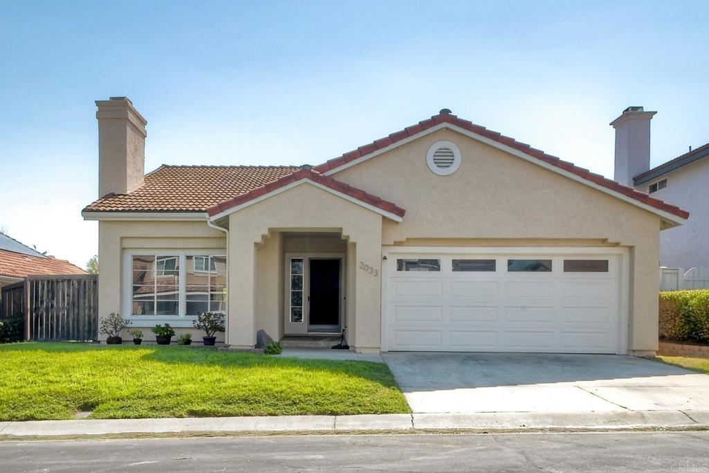 Flooded with natural light and thoughtfully updated throughout, this single-level 3-bedroom, 2-bathroom home is tucked inside the secure gates of Sandalwood—a peaceful community offering top-tier amenities and a lifestyle of convenience. With fresh interior and exterior paint, new carpet in the bedrooms, luxury vinyl plank flooring, and soaring ceilings, the home balances warmth with spaciousness in every room. Enjoy the value and efficiency of paid-off solar panels, a newer LG washer and dryer, and an open-concept layout perfect for both relaxing and entertaining. The expansive backyard offers endless potential, while the attached two-car garage with direct access adds everyday functionality. Sandalwood residents benefit from access to a private community pool, tennis courts, walking trails, a park, and a tot lot. Set just minutes from Guajome Regional Park, Rancho Guajome Adobe, and everyday essentials, this home is also walkable to Guajome Park Academy (K–12, Niche-rated A) and just 12 minutes from Mission Vista High School (GreatSchools 10/10, Niche A+). A rare blend of comfort, location, and lifestyle in one of North County’s most welcoming neighborhoods.