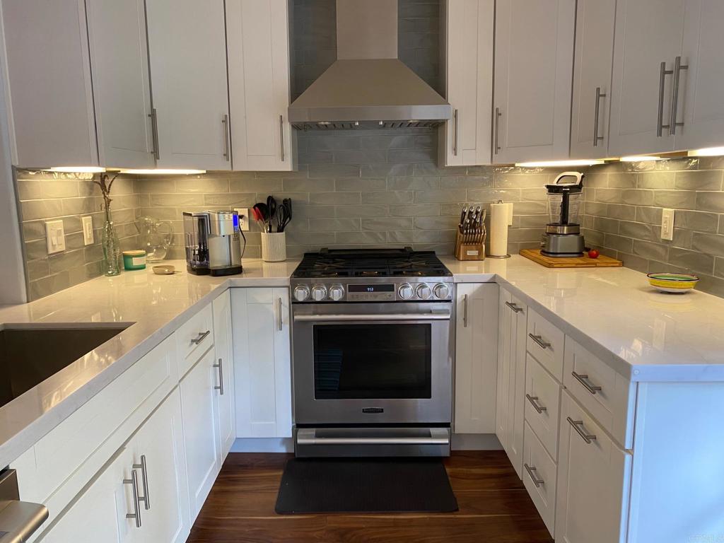 Beautifully remodeled condo in charming Hacienda De La Playa! Rarely on the market, this private end unit has rich wood floors, a cozy fireplace, french doors & recessed lighting in an open floorplan. The upgraded kitchen has white shaker-style cabinets, Quartz countertops, stainless steel appliances & separate wine refrigerator. You will love the outdoor living with two lush patios for entertaining or relaxing. Both bathrooms are also remodeled with white shaker-style cabinets and stone countertops. Both bedrooms have custom built-in cabinets for additional storage.You will enjoy the convenience of a full size washer and dryer inside the home in a laundry closet. This desirable community is within walking distance of "Encinitas Village" where you will find shops, coffee houses and restaurants. You are close to the ocean and many vistas with ocean views. Outdoor living is easy in this perfect location for biking, running and walking to everything in Encinitas. The community has a lovely landscaped pool and spa to enjoy and share with friends. Condo is available from October 1, 2025 - May 30,2026.