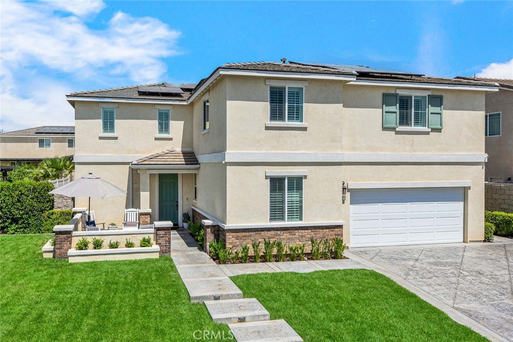 Price Improvement – Now $975,000! Turnleaf Beauty with Solar, Designer Upgrades & Pool-Sized Backyard
Welcome to this stunning two-story residence in the sought-after Turnleaf community of Jurupa Valley. Built in 2019, this 3,386 sq. ft. home offers 5 bedrooms, 3 full bathrooms, a large bonus room, and a 3-car finished garage — all enhanced with custom upgrades you won’t find in most homes nearby. The heart of the home is the chef’s kitchen with extended cabinetry, quartz countertops, stainless steel appliances, walk-in pantry, dual beverage refrigerators, glass-front cabinets, LED accent lighting, and an oversized island. The open floor plan flows seamlessly into the family and dining rooms for everyday living and entertaining. Upstairs, the primary suite is a private retreat with spa-style bathroom and walk-in closet. Each secondary bedroom has its own walk-in closet (one with two!), plus a spacious bonus room for a media room, office, or playroom. The upgraded laundry room with sink and cabinetry adds convenience. Notable upgrades include owned solar panels, luxury vinyl plank flooring, plantation shutters, upgraded stair skirt with glass railing, custom trim and baseboards, fresh paint, and thoughtful storage solutions throughout. The garage features overhead racks and a Tesla charger, while outdoors you’ll enjoy a pool-sized backyard with extended covered patio, stamped concrete, and upgraded entry steps.
Set on a quiet cul-de-sac, the home is walking distance to the community park and K–8 school, with easy freeway access. With its new price, abundant upgrades, and energy savings, this Turnleaf home is one of the best values on the market today.