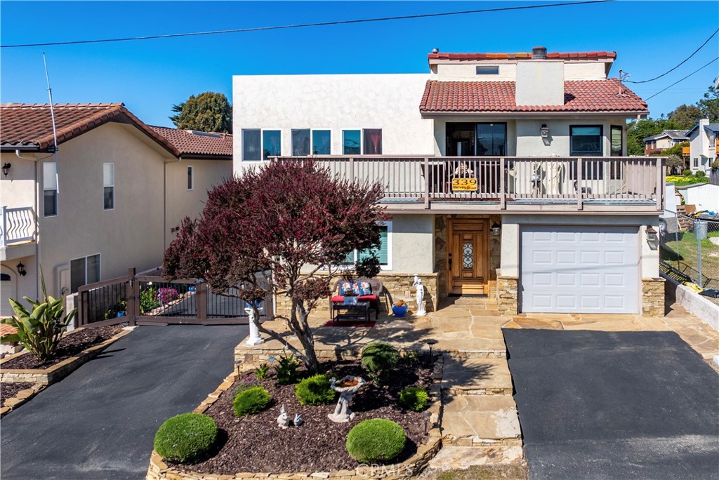 ***PRICE IMPROVEMENT*** This charming coastal home on Harvey Street in Marine Terrace offers the perfect blend of style, comfort, and seaside living. There are multiple ocean views from the living room as well as the decks that sweep around this home. With 3 bedrooms and 2 bathrooms, the home features a reverse floor plan—the bedrooms are located on the entry-level, while the main living space and kitchen are on the second floor, allowing for excellent light and flow. From there, a staircase leads up to a spacious rooftop deck, ideal for taking in ocean breezes, sunsets, and stargazing. The home’s entry level includes a welcoming sunroom, plus two of the bedrooms have sliding glass doors that open directly to the backyard, offering seamless indoor-outdoor access. The backyard is beautifully landscaped, complete with a modern fire pit lounge area perfect for relaxing or entertaining. Upstairs, the remodeled kitchen features granite countertops, stainless steel appliances, and bar seating. The space is bathed in light from oversized windows and skylights, and the open-concept design creates a warm and inviting atmosphere. An additional family room was added on as well. Durable vinyl plank floors run throughout, and Milgard windows enhance energy efficiency and comfort. Outside, you’ll find a Tuff Shed with electricity, ideal for creative projects or storage. There is a 220 volt for electric vehicle charging as well. Harvey Street provides direct access to the beach, just moments away. With its thoughtful layout, stylish finishes, and unbeatable location, this home is a true coastal retreat.