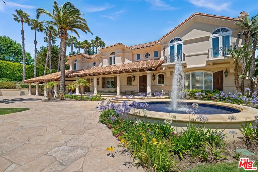This Idyllic Mediterranean Estate on 2+ Acres at the heart of Point Dume with 180* Promontory Ocean and Point views combines traditional sophistication, warmth, and timeless European design in a private and peaceful So Cal setting. World class amenities include Gated Entry, Resort Lagoon pool with hot tub & water feature, tennis/sport court w/ equipment room, pool house w/outdoor kitchen, dining, bar, living area w/ fireplace, gated motor court with multiple parking spaces & guest parking, detached one bedroom guest house, and a wine cellar. This offering includes a 74,512 Sq Ft. main lot + an additional smaller 14,348 Sq. Ft. lot that connect to each other at the lower sports field where kids have the freedom to run and play or to accommodate larger events. At approximately 10,000 Sq Ft. the main residence features Public Rooms on the first floor and Private Family living on the second floor. Access the second level from one of two staircases to find an incredible Primary Suite featuring Coastline, Ocean, and Horizon Views, bath with steam shower, jetted tub, dual sinks and water closets, and dressing room. Completing this level are 3 additional bedroom suites with full ensuite bathrooms, a dance/yoga studio, and an executive office. On the first floor, rooms are expansive and the floor plan is thoughtfully set and positioned toward the views. The Great Room faces the Pool and a children's play area. Its features include eat-in dining, wet bar, wood burning fireplace, and breathtaking Point Dume & Ocean Views. At the heart of the home is a Gourmet Kitchen with breakfast nook and counter dining, full suite appliances, dual refrigerators, custom Scandinavian cabinets, and pantry and service areas both of which are nearby the formal and casual dining. Completing the lower level is an entertainment room with pool table and fireplace as well as full Maid's Quarters w/ ensuite bath & service entrance. This seasoned home is strategically positioned on this exceptional lot to take full advantage of Malibu's impressive Sunsets and coastal breezes. Move right in and enjoy, or take advantage of the current size of the home and its' layout to cosmetically update and personalize to make it your own.  Text agent for a quick reply.