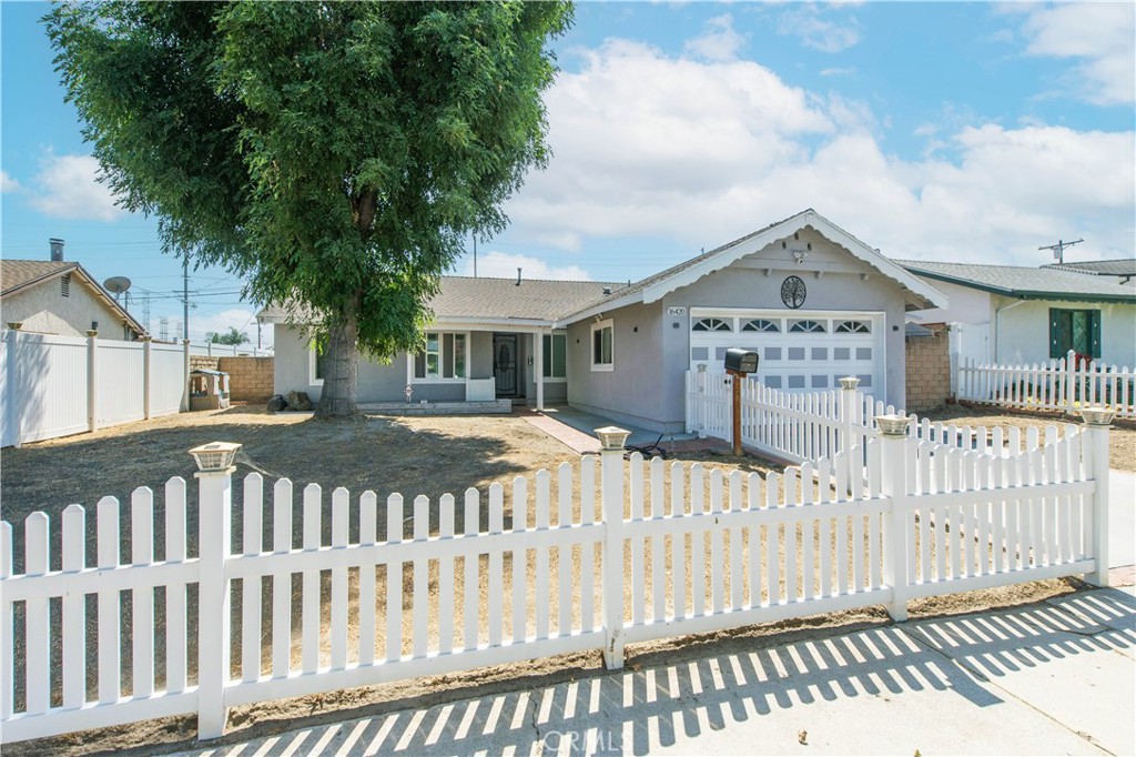 Welcome to this charming home nestled in the highly desirable North of Rinaldi neighborhood of Granada Hills. Tucked away on a peaceful cul-de-sac, this residence greets you with a classic white picket fence and an inviting front porch that sets the tone for the warmth inside.
Step into a light-filled, open-concept floor plan designed for both comfort and functionality. The remodeled kitchen showcases granite countertops, stainless steel appliances, and soft-close cabinetry, with a convenient laundry room just off the kitchen. Both bathrooms have been tastefully updated, complementing the home’s modern style. Three generously sized bedrooms provide the comfort and flexibility you’re looking for. The low-maintenance backyard features a covered patio and spacious side yards, creating the perfect setting for outdoor entertaining or relaxation. Additional highlights include newer dual-pane windows and sliding glass door, updated flooring, crown molding, recessed lighting, smooth ceilings, durable vinyl fencing, and more. This home blends timeless charm with thoughtful upgrades—ready for you to move right in and enjoy.