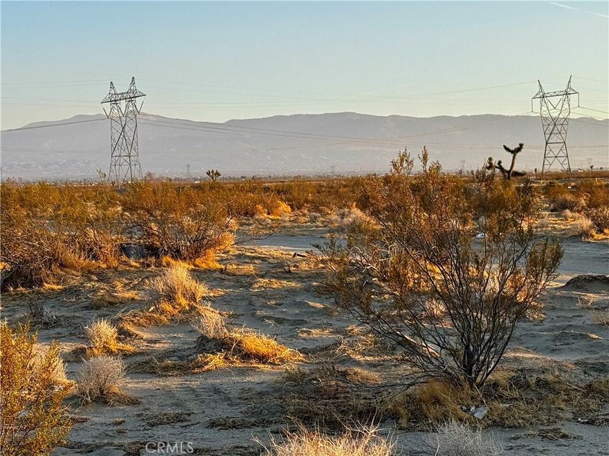 • EXCELLENT OPPORTUNITY TO BUILD YOUR DREAM HOME OR INVEST IN VACANT LAND! • 7.58 Acres | RL-5 Zoning with Flexible Uses - Manufactured Homes OK! NO HOA! Two Adjacent Parcels Available ±15 Acres Total! Rural Living Yet Surrounded by Homes including 4551 Sandstone Road! Water Fill Station Nearby! About 330 Feet of Frontage is at Sandstone Road with power lines at backside at Powerline Road! Property is 2 Miles from Sheep Creek Road and has close proximity to Highway 18! Approximate GPS Coordinates: 34.5496, -117.5427 | Parcel Number: 3130-211-01-0000