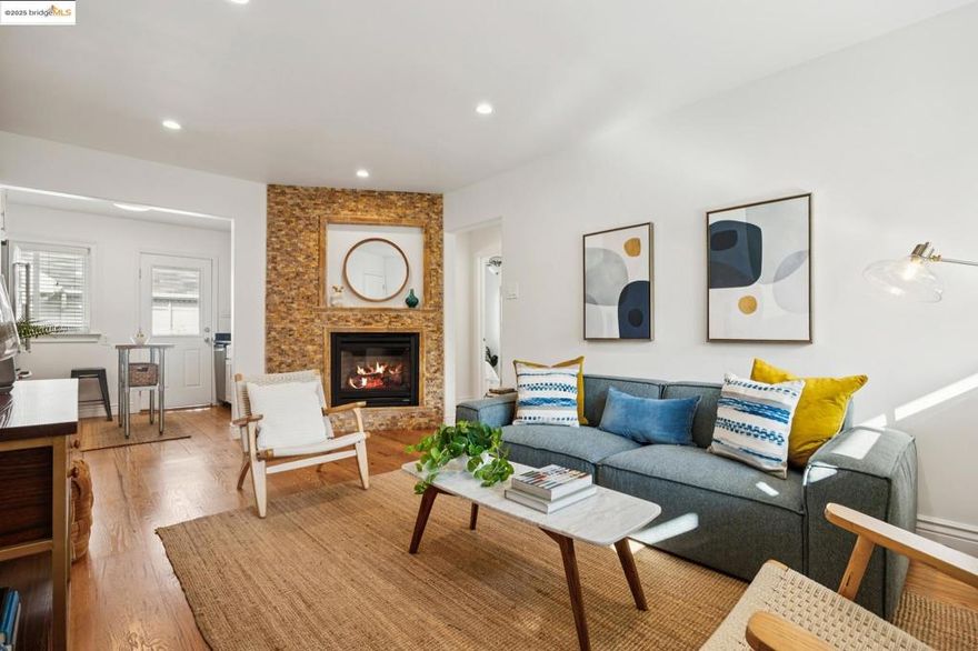 This centrally-located, top-floor, beautiful condo is move-in ready with refinished hardwood floors and new interior paint throughout. With light and bright rooms and an open-concept main living area, it feels spacious and cheerful. In addition, the "heart" of the condo and focal point of the living room is the angled wall with a remote-controlled, heat-producing, gas fireplace surrounded by beautiful stonework. The kitchen has been refreshed with painted cabinets and a new dishwasher. Two sunny bedrooms offer plenty of closet space, enhanced with mirrored closet doors and the bathroom boasts a marble floor and spa tub. Located just blocks from Berkeley's "Gourmet Ghetto" with plenty of fine restaurants, shopping and public transportation.