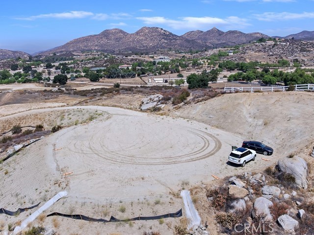 4.27 Acres – Prestigious Temecula Wine Country
An exceptional opportunity to create your private estate in the heart of Southern California’s wine country. This build-ready 4.27-acre parcel offers breathtaking panoramic views of rolling vineyards and the Temecula Valley. All planning and permitting are complete, with professionally graded pads, detailed perc test, and soils engineer reports in place. Ample space for a grand main residence, guest house, equestrian facilities, or vineyard. Ride for miles right from the property. Architectural house plans are available for a seamless start to your vision. A contiguous finished parcel is also available, ideal for a larger compound or multi-generational retreat. Seller may carry as well. Minutes to wineries shopping and town. Embrace the beauty and lifestyle of wine country living.