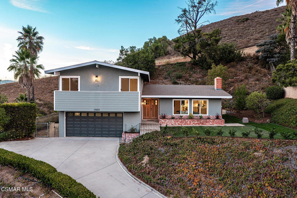 Perched on a scenic lot with some of the best panoramic views in the Conejo Valley, 1559 Calle Zocalo is a beautifully remodeled tri-level home that blends modern style with everyday comfort.The airy main level is filled with natural light, framed by expansive picture windows that capture rolling hillsides and spectacular sunsets. From the refreshed living areas, entertaining flows seamlessly to a spacious view patio - perfect for gatherings or quiet evenings outdoors.This home has been thoughtfully updated from top to bottom, featuring new finishes throughout, remodeled bathrooms, refreshed flooring and lighting, and a sleek, contemporary palette. The fully remodeled kitchen shines with new appliances, updated cabinetry, and stylish countertops. All four bedrooms are conveniently located on the same level, offering both privacy and practicality. Each bathroom showcases tasteful updates, featuring modern finishes enhanced by a warm and inviting touch.Outdoors, the expansive front and backyards offer endless possibilities. A unique hillside stairway leads to a private perch where you can take in some of the most unobstructed views in Thousand Oaks - a true highlight of this property.Perfectly situated across the street from Canada Park and within minutes of top-rated schools, shopping, dining, and outdoor recreation, this move-in-ready home combines scenic beauty, modern upgrades, and a prime location.1559 Calle Zocalo isn't just a home- it's a lifestyle where convenience, community, and breathtaking views all come together.