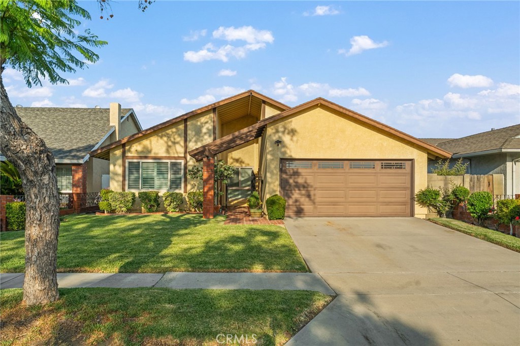 Nestled in one of Cerritos’ most sought-after neighborhoods, this beautifully maintained home is a true standout. From the moment you arrive, the curb appeal shines with manicured landscaping and a picturesque, tree-lined street that welcomes you home. Step inside through the private, secured courtyard and you’ll be greeted by a bright, airy living room featuring soaring ceilings, fresh paint, and a large front window that floods the space with natural light.The heart of the home continues into the family room, seamlessly connected to a spacious kitchen with abundant cabinetry, sleek stainless-steel appliances, and a stylish bar counter—perfect for casual breakfasts or gathering with loved ones. Whether it’s movie nights, family time, or simply relaxing, the family room provides the perfect setting.The bedrooms are generously sized with ample closet space. The primary suite is a true retreat, boasting high ceilings, a private en-suite bathroom with dual sinks, and a spa-like atmosphere ideal for unwinding after a long day. Step outside to a private backyard oasis complete with a covered patio, cooling ceiling fan, and lush landscaping—perfect for weekend BBQs, entertaining friends, or enjoying quiet evenings under the stars.This home combines comfort, style, and an unbeatable location with an amazing school district... making it the perfect place to create lasting memories.