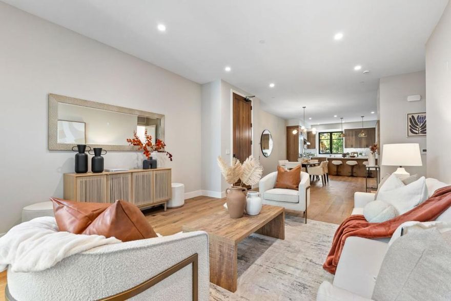 Discover quiet luxury and modern elegance in this exceptional downtown residence. The open-concept living room features soaring ceilings and luxury NanaWall folding glass doors, filling the home with natural light and creating seamless flow between spaces. The chefs kitchen is outfitted with Thermador appliances, integrated refrigerator and dishwasher, and custom wood cabinetry that perfectly blends function and elegance. Each bedroom is a private suite -- a rare All-Suite design in the Bay Area.   Enjoy engineered wood flooring throughout and THREE extraordinarily large private balconies -- each spacious enough to feel like your own backyard retreat -- ideal for BBQs, outdoor dining, morning yoga, or evening gatherings under the stars. Built with enhanced sound-insulation, this home offers exceptional quiet and privacy even in the vibrant city core. Additional highlights include 2 underground parking spaces per unit, EV-charging infrastructure, a gated community with landscaped courtyards.   Unbeatable location -- walk to cafes, fine dining, shopping, and Caltrain; minutes to major highways (101, 85, 237), and top tech campuses including Google, Meta, Nvidia, Apple and many more. Live where innovation meets style, enjoy modern elegance in the heart of Silicon Valley.