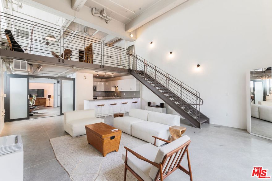 Welcome to this industrial and spacious 2 bedroom, 2 bathroom rental in the iconic Flower Street Lofts building of South Park, Downtown Los Angeles. This two story unit boasts 1,568 square feet of space with concrete floors, central air, and an in-unit washer and dryer. The kitchen is well equipped with stainless steel appliances and a large counter. The expansive living area opens to a private patio space which makes it conducive to hosting intimate get-togethers with friends and family. The primary bedroom is located in the second story and includes a walk-in closet. The second bedroom is located downstairs and is perfect for guests or as a home office. Enjoy the convenience of living very close to Crypto.com Arena, Ralphs, Whole Foods, and countless cafes & restaurants. Rent is inclusive of 2 parking spaces, water, cable, and internet. This rental is pet friendly.