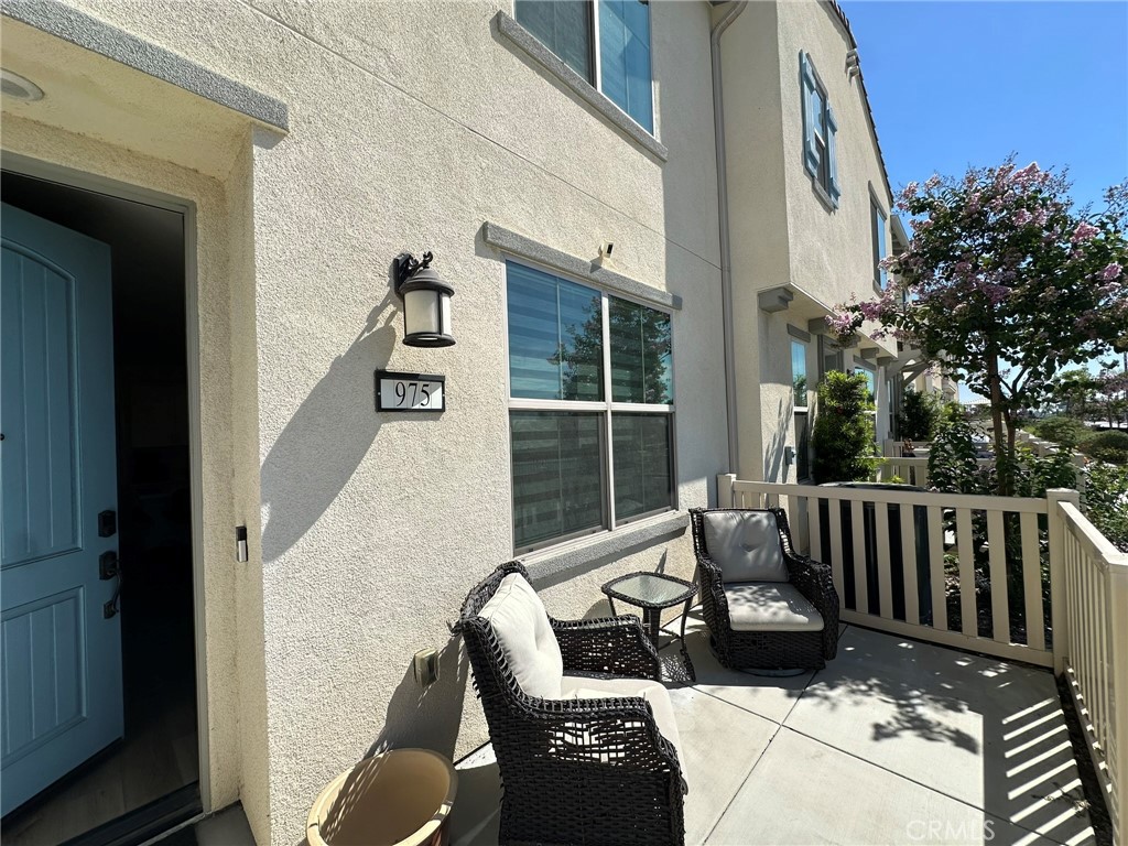 Welcome Home! 975 W. Clover is located in one of Rialto's Newest, Well-Maintained, Gated Communities - Foothill Grove. Built in 2021, this Beautiful, Newer Complex offers Walking Paths, Areas to Picnic, a Gated Swimming Pool & Spa, as well as a Playground. The Unit itself is in a Superior location as the front faces the street, not other units. Enjoy the Best in Modern Luxuries-- a Spacious Great Room with 9' Ceilings, a 2-Car Garage with EV Charger, a Large Gourmet Kitchen with Quartz Countertops, Stainless Steel Appliances, a Huge Center Island Perfect for Entertaining, and Shaker-style Thermafoil Cabinetry providing Plenty of Storage. The Primary Suite is Massive - offering a Generous Walk-In-Closet and Bath, with Soaking Tub and Shower. High-Quality Furnishings can even be included in the sale, allowing one to close, MOVE in & start living in comfort. Solar panels are included for a small monthly fee, and historically generate enough power to eliminate high monthly bills. Other features include a Schlage programmable front door, tankless water heater, and programmable Smart Home system. Not to mention, the Complex is a short, WALKING distance to Multiple Major Shopping Centers. A Beautiful Unit, in a Beautiful Complex, near Major Stores -- It's the Perfect Trifecta!
