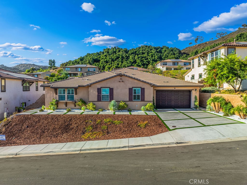 Welcome to 2428 Monroe Place, a show stopping home in one of Escondido’s most coveted neighborhoods, overflowing with upgrades and designed to impress at every turn. Step inside to a gorgeous living room with a bold accent wall, designer kitchen chandelier, upgraded pendant lights, stylish ceiling fans, and custom shutters throughout that bring both elegance and functionality. The floor plan has been thoughtfully enhanced with an extended pantry converted into a private home office, an additional pantry with custom cabinetry and fridge space, and an upgraded laundry room with sleek built-ins. Luxurious touches include a Jack & Jill bathroom, a bathroom with bidet, whole home water filtration system, garage cabinets, and the huge bonus of fully PAID-OFF SOLAR . But the real showpiece is the entertainer’s backyard...your own private resort right in your backyard, complete with lush landscaping, a sparkling POOL and SPA, an immersive surround sound system, three outdoor TVs perfect for game days and movie nights, and a side-yard putting green to keep your golf swing dialed in. This home is the ultimate blend of luxury, lifestyle, and convenience a true gem that delivers that California dream!!