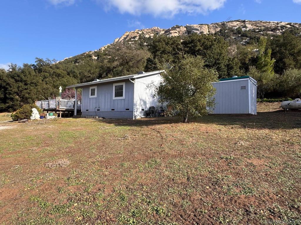 Due to lack of road easement, owner ship may be limited to Barona Indian Tribal members. Per tribal council, no easements are to be sold to any new owners. Barona tribal members are allowed to access without an easement. Enjoy peace and tranquility! Panoramic scenic mountain views on 40 rolling acres! Rare opportunity to own property that borders Barona Indian Reservation and Audubon Society land. Excellent location close to casino. Has solar, septic and well! Other features include laundry and separate storage room, outdoor shower. Trailers are negotiable.