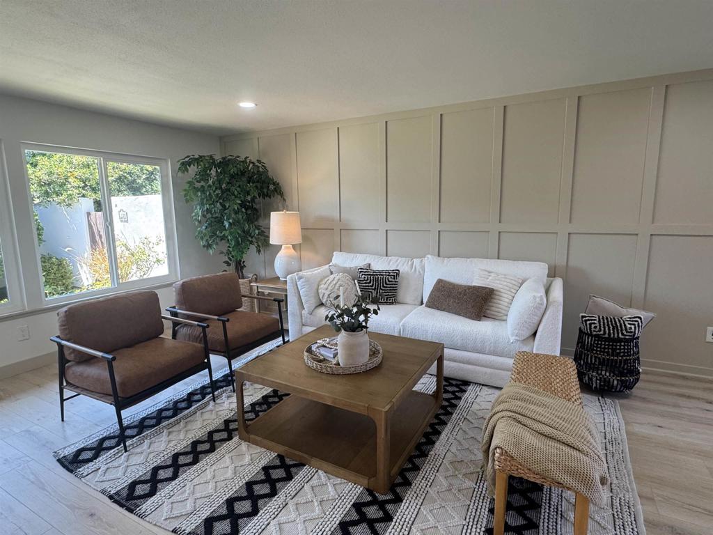 Welcome to this beautifully updated 2 bedroom, 2 bath condo in the highly sought-after Seven Oaks Haciendas, a 55+ community known for its peaceful setting and active lifestyle. This home has been thoughtfully renovated throughout, featuring brand-new dual-pane windows, fresh interior paint, and stylish luxury vinyl plank flooring, gorgeous board and batten wall in living room. The kitchen is completely new, with quartz countertops, shaker cabinets, and stainless steel appliances. Bathrooms are also completely renovated with luxurious finishes. Additional upgrades include a Brand New HVAC system, recently replaced hot water heater offering comfort and peace of mind. The spacious, private patio includes a laundry area, and there’s an adjacent carport plus a separate storage room for golf cart or just extra space for added convenience. Residents enjoy access to a well-equipped community center with a pool, gym, library, and a variety of clubs and classes making it easy to stay active and connected. HOA also covers water, trash, exterior maintenance,This home truly has it all! Don’t miss your chance to make it yours.