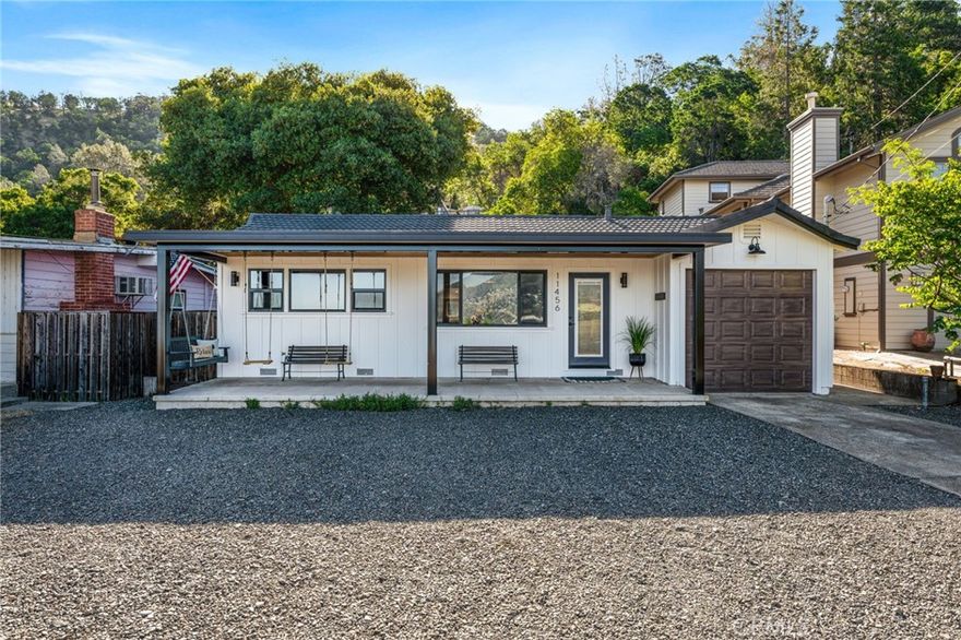 Lake Front Property on Silverado Beach. This home was completely renovated in 2023 to offer a comfortable, functional, modern home on a lake front parcel. Enjoy the Lake Life from this single level home, it offers an open floor plan with the most beautiful views of Clearlake and Mt. Konocti that Lake County has to offer. Everything redone to this home was finished with taste and care. Entire home has new windows, doors, electrical, plumbing, insulation, drywall, floors, cabinetry, lighting, nothing went undone. A welcoming open floor plan greets you immediately, bright and open space for entertaining and enjoying your days. Located off the living are 2 bedrooms, the laundry room and a custom tiled full bathroom. Centrally located in the home is a Bonus Room. This space is wide open, has vaulted beamed ceilings and can be enjoyed as a media room, game room, 2nd living room or used for work or any other hobbies. There is a 1/2 bath located in the bonus room as well as the French doors leading to the back yard. The primary suite is located privately at the rear of the home, through French doors to allow for a Lake View from your bed. This primary suite has vaulted beamed ceiling with a walk-in closet with a vanity area, and a private bathroom. The bathroom has a custom tiled walk-in shower with a seamless shower glass enclosure. The entire home is wrapped in new board and battened siding, seamless gutters, and a metal roof for fire safety. The front porch is the ideal place to enjoy a picturesque sunset, sit on any one of the customs swings and take in all the beauty that Lake County offers. This home comes with 2 additional parcels lake front parcels; one is a dock and pier while the other is the private boat ramp. The property is also in the Silverado Beach Improvement Association for a low annual fee you will have rights to the shared beach, boat ramp dock and pier located across the street.