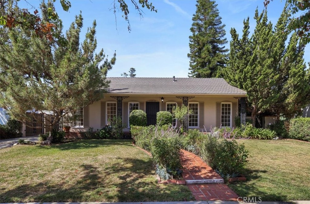 Unlock the potential in prime Sherman Oaks. Located in Valleyheart Glen a charming, well-maintained neighborhood known for its peaceful atmosphere, clean streets and friendly community, moments from Ventura Blvd. Nestled on a picturesque, beautiful tree-lined street with colorful Jacarandas and Magnolia trees. From its superb curb appeal with a meandering brick walkway, romantic brick porch and decorative wrought iron columns and abundant large wood pane windows and front gardens and trees, this classic 1949 home draws you in. First time on the market in 71 years, this rare opportunity offers a spacious 3-bedroom, 3 bathroom home with 2,028sf of living space on an oversized 9,629 sf lot that is ready to be reimagined and offers a tremendous upside and future value. The outstanding floor plan features a spacious large living room with fireplace and separate dining area. The generous sized family room has a wet bar, rich wood beam ceilings and sliding glass doors to an inviting large covered brick patio with a built-in bbq, fireplace and exciting magical lush grounds. Spacious ensuite primary bedroom and sliders to outdoor brick patio. All bedrooms are well sized, and the home offers great bones for a full-scale remodel, expansion or even a ground-up re-design. Well positioned large vintage kitchen with eat-in area, laundry room, plentiful storage cabinets and framed by mostly hardwood floors and an AC installed in 2017. The oversized lot provides endless options, room for a pool, ADU, or major addition. Whether you’re a developer, flipper or an end-user looking to create your dream home in one of the Valley’s most coveted neighborhoods, this property delivers on location, lot size, and upside. The enchanting verdant lush grounds is a standout-private, peaceful, oversized with additional open patio areas and a surprising secret extended backyard offering a unique sense of space and seclusion backing to the LA River wash with no direct rear neighbors. Easy access to shops, freeways, top-tier amenities, transportation, dining, parks and top-rated schools, this is a true diamond in the rough. Bring your vision and your contractor – homes like this rarely hit the market. Successor Trustee sale not subject to court confirmation.