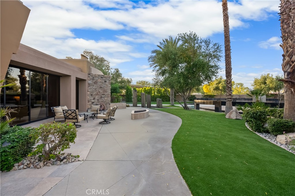MONTHLY RATES STARTS AT $15,000 PER MONTH. SEASONAL RATES APPLY. PLEASE INQUIRE.
Dream Desert Vacation at Sprawling Contemporary Estate, GREAT VALUE
Summary: AWARD WINNING luxury home with sweeping mountain and golf course views
Enjoy incredible sunsets and sunrises from this dream vacation home — a one-of-a-kind work of art.
With sweeping views of 10,000 foot high snow covered mountains and a private golf course, this 9-bedroom, 7,800-square-foot luxury home juts up from the desert landscape as the crowning jewel of this multi-million-dollar neighborhood, Westgate. Westgate is a gated neighborhood within a private country club, and has 0.5 to 1.5 acre estate homes on the golf course. Truly unique.
As an internationally award winning home for its architecture. Great for large family gatherings, business events, cultural events, golf outings, celebrations, and romantic getaways. The home features light-flooded living spaces, high end finishes, patios off every room in the home, a pool and spa with a swim-up pool bar, and lush bedroom suites. With TEN massive 10 foot high pocket sliding glass doors (disappearing walls of glass), this home redefines indoor/outdoor living at its finest, bring the surrounding landscape into the home from every room in the house. Artfully designed spaces invite and delight.
Modern Mansion Oasis can easily accommodate up to 24 guests. The main house includes 6 bedrooms (5 with en suite baths); the guest house features another 3 bedrooms and 2 ensuite baths (one jack-and-jill for the third bedroom), for a total of 9 comfortable sleeping areas.
You’ll arrive via the estate’s private, circular motor court, outfitted with tall Basalt column sculptures, cascading water features, and glass bridges from the motor court to the front door. The entryway is reminiscent of a five-star resort — and the five-star experience doesn’t stop there.
Extraordinary attention to details abounds throughout the residence. The main living space features a relaxing home theater and connects to an open kitchen with state-of-the-art appliances. Sunken wet bars, a catering kitchen/butlers pantry, and an outdoor grill and bar make entertaining a breeze. The estate’s various outdoor fireplaces, exquisitely landscaped plots, and covered lounging areas lend themselves well to relaxing and tasteful events.
Minimum 30-day rental is required.