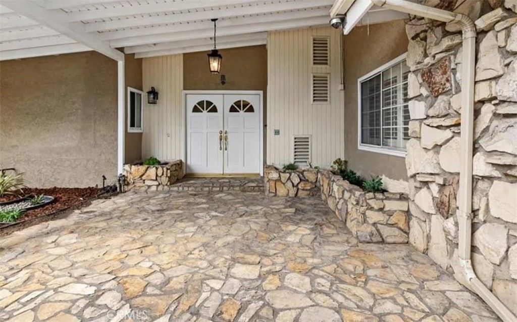 Explore the charm of this area and envision the limitless possibilities. A golden opportunity truly awaits you! Nestled in a desirable Northridge neighborhood, this residence exceeds all expectations. This charming 4-bedroom, 2-bathroom home offers a perfect blend of comfort. Step into the living room and dining area, bathed in wonderful natural lighting streaming through the windows and French doors. As you enter through the welcoming double doors, you'll be greeted by a spacious living room featuring a charming granite fireplace. This beautiful home offers hardwood floors, recessed lighting, built-in cabinets, window shutters and central air and heat throughout, ensuring year-round comfort. The adjacent family room seamlessly flows into a generously sized kitchen adorned with gleaming granite countertops, providing ample space for your culinary endeavors and family gatherings. Step outside to discover a sprawling covered patio with tiled and stone floors, creating the perfect setting for outdoor barbecues, entertaining, or simply unwinding. This beautiful home is near schools, shopping centers, entertainment and much more. Do not miss out on this one-of-a-kind place to call home! Schedule a tour today.