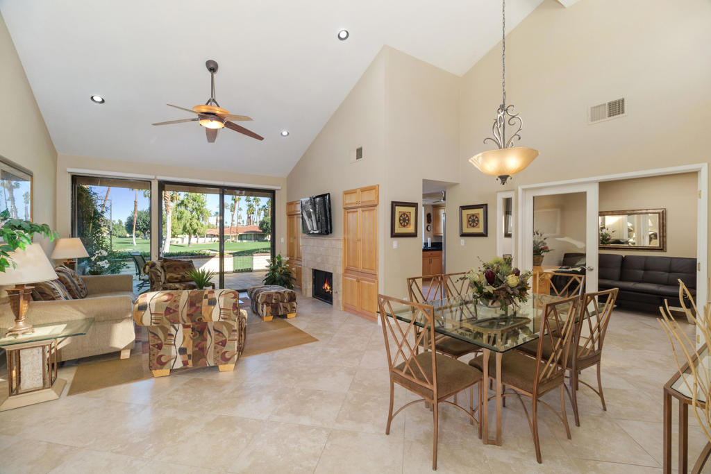 Welcome to Monterey Country Club--one of the most desirable communities in the Coachella Valley! Perfectly positioned on a premium wide fairway lot along the 1st fairway of the South Course, this home showcases breathtaking panoramic views of the lush golf course framed by the majestic mountains beyond. Step through a private, enclosed courtyard into a stunning entryway highlighted by a custom medallion inlay, setting the tone for the home's refined style. Inside, the soaring vaulted ceilings, clerestory windows, and open layout create a light-filled, airy ambiance. The living room is anchored by a designer fireplace with built-in cabinetry, the perfect blend of warmth and sophistication--ideal for both relaxing and entertaining. The chef's kitchen has been beautifully updated with granite countertops, stainless steel appliances, custom cabinetry with pull-out shelving, and a Culligan water filtration system. Indoor-outdoor living flows seamlessly to the expanded back patio, where you'll enjoy spectacular morning sun, colorful desert sunsets, and endless fairway views. Offering 2 spacious bedrooms, 2 remodeled bathrooms, and a versatile den/office, this home is designed for both comfort and flexibility. French glass doors create effortless transitions between spaces, while the serene primary suite provides a private retreat filled with natural light. Monterey Country Club is a true resort lifestyle destination, featuring 27 holes of championship golf, 37 pools & spas, tennis, pickleball, bocce ball, a fitness center, and a vibrant clubhouse with an on-site restaurant. Furnishings and a golf cart are included--making this an exceptional opportunity to embrace the desert lifestyle from day one.
