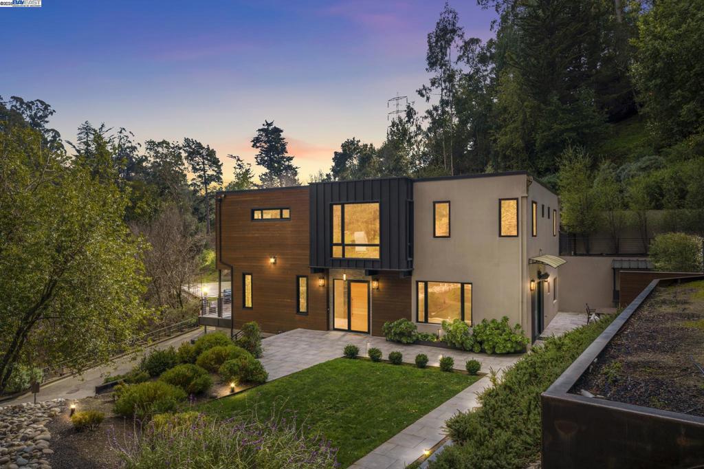 Welcome to 3 West Cir, a custom-built masterpiece nestled in the serene Montclair neighborhood of Oakland Hills. This 3,994-square-foot contemporary residence blends modern luxury with functional design, featuring four spacious bedrooms, each with its own en-suite bathroom. The stunning primary suite boasts a private balcony, oversized closet, and a spa-like bathroom with a walk-in shower and freestanding tub. The open-concept kitchen and family room seamlessly connect to a lush backyard, perfect for indoor-outdoor living. A standout feature is the upstairs office with floor-to-ceiling glass windows, offering an inspiring workspace immersed in nature. Situated on a tranquil 12,719-square-foot lot, this home is a true retreat, balancing elegance, comfort, and convenience just moments from Montclair’s vibrant community.