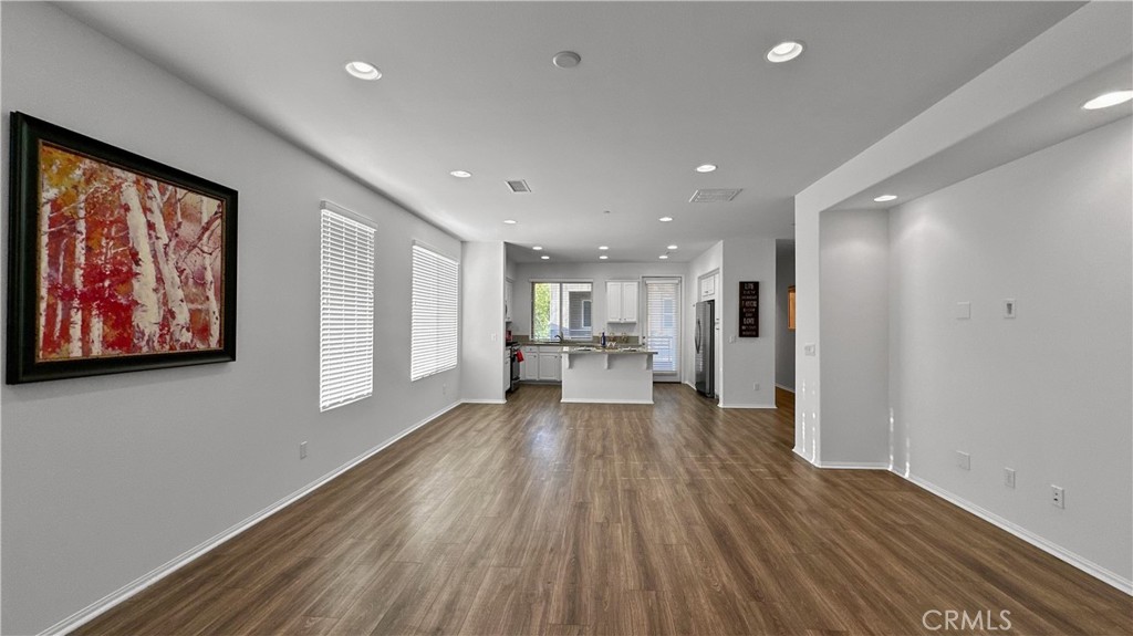 End unit; 2 bedroom suites; main floor bedroom suite; open floor plan; in-unit laundry; large primary suite with high ceiling; newly & professionally painted & cleaned; stainless steel appliances; large balcony off kitchen; abundant natural light; guest parking spaces available; well-maintained; great schools; convenient location for shops & restaurants.