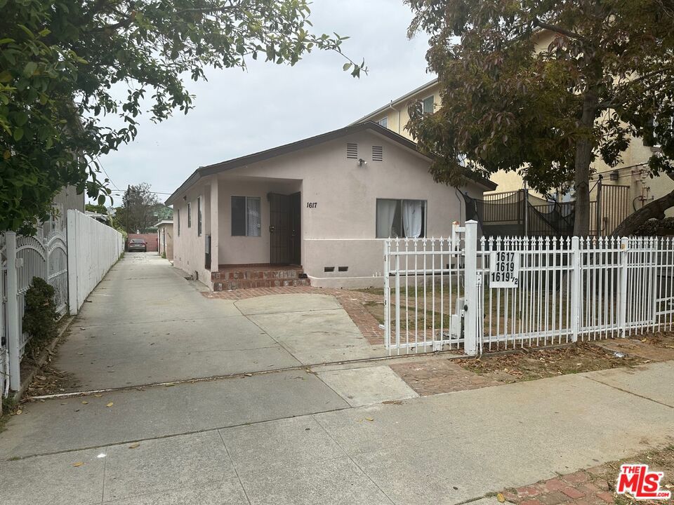 3-bedroom house in front with a duplex behind (both 1-bedroom) all on a large 40x180 flat-lot. All units have individual water heaters, separate gas & electric meters for reduced expenses, and tenants pay for their own trash collection. The complete lot behind the front house is paved with concrete to allow open parking for several cars and other vehicles . SFR: The 3 bedroom, 2 bathroom, house is approx 1014 sq ft and features wood and tile floors; newer large kitchen with dine-in area, tile counters, dishwasher, stove/oven and refrigerator; aluminum windows; raised foundation and attic area for easy modifications; . Duplex: The two 1-bedroom units have a very efficient floor plan even though they're only 500 sq ft each. All units are remodeled and in good conditions. Large LARD2 Lot with a great potential to be developed in the future. This property is located in a nice residential neighborhood .