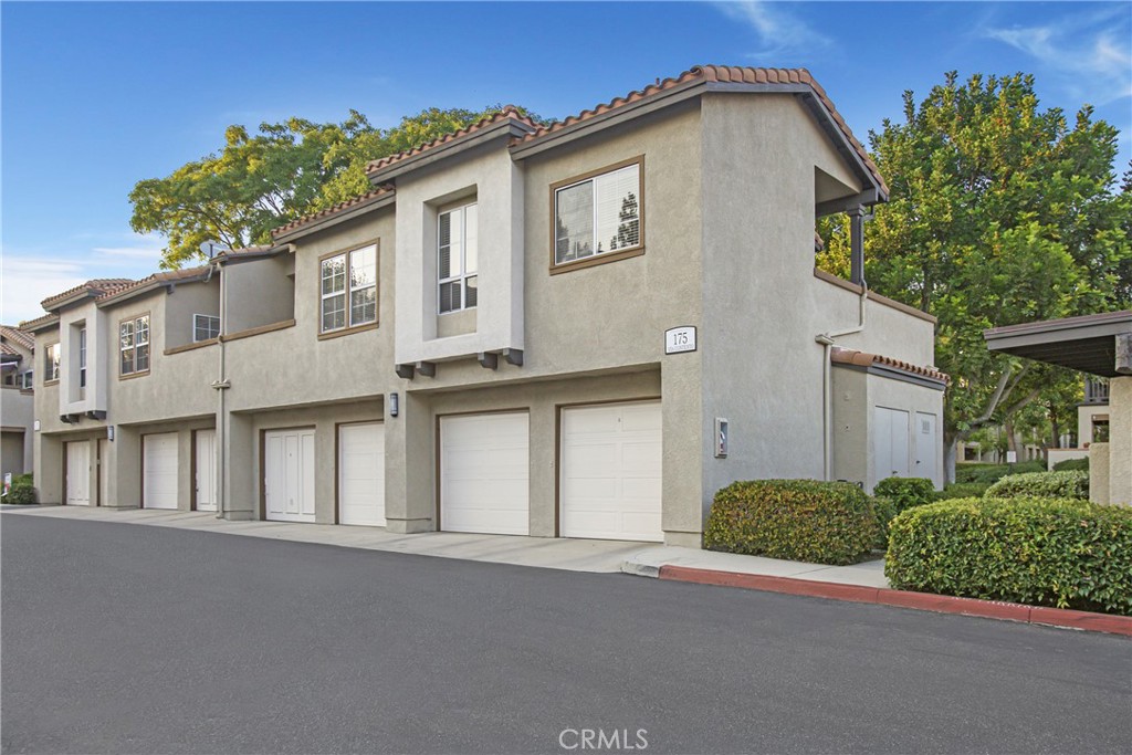 Located in a peaceful corner of Tijeras Creek Villas, this beautifully upgraded 2-bedroom, 2-bath condo offers views of hills, mature trees and a park-like greenbelt with tot lot, picnic area, and BBQ. The spacious living room features cathedral ceilings, corner two sided fireplace and ceiling fan. The remodeled kitchen is light and bright with windows on two walls, fresh white cabinetry, recessed LED lighting, generous counter space and stainless steel appliances including counter-depth refrigerator with ice maker, microwave, and 5-burner gas range. The primary suite includes cathedral ceilings, a private balcony, a wall of closet space and remodeled en-suite bath with walk-in shower. The spacious secondary bedroom and full bath are located just down the hall, along with the interior laundry —washer and dryer included. Enjoy the convenience of the over sized one-car garage with opener at the base of your steps, plus a reserved parking space. Move in ready with NEW paint and NEW carpet throughout, newer AC, upgraded baseboards and bronze door hardware. Community amenities include 2 pools, one overlooking the beautiful Tijeras Creek Golf Course, spa, sauna, fitness center, tot lot and picnic area. Miles of hiking and biking trails. Access to all the SAMLARC amenities with pools, tennis, pickleball, volley ball, sport courts, parks, beach club and splash park. Centrally located walking distance to the award winning Arroyo Vista K-8. This home offers comfort and convenience in California’s safest city.