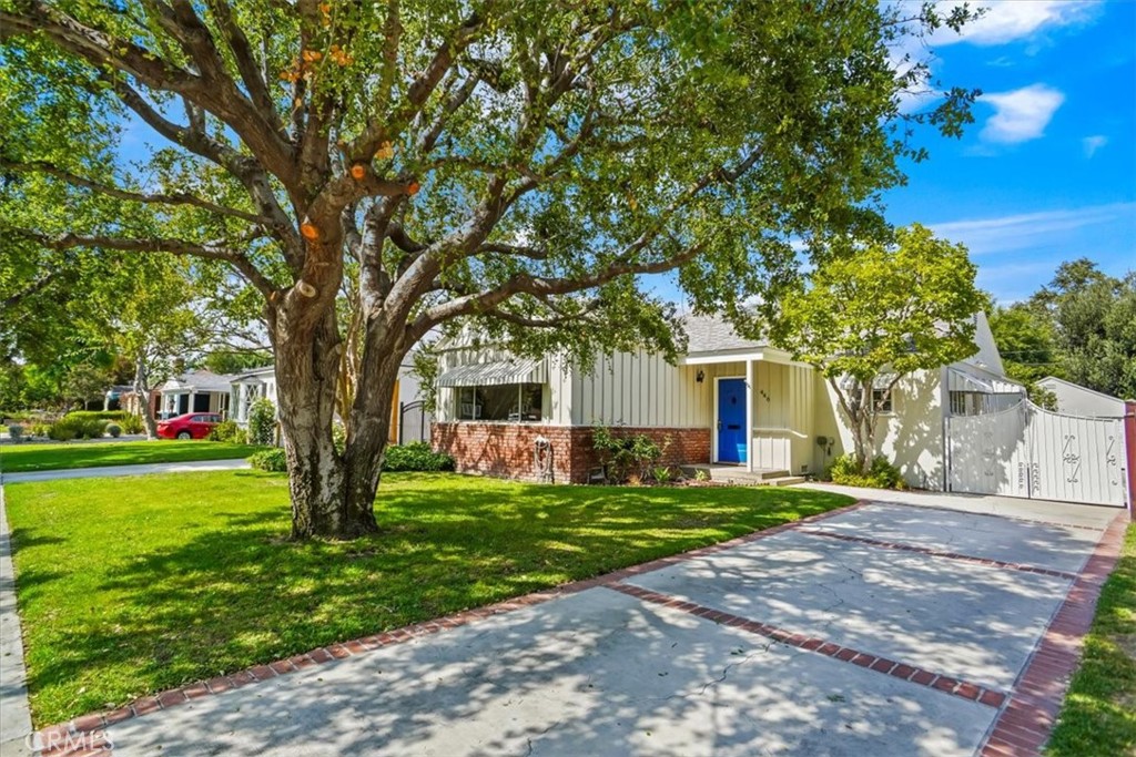 Welcome home to this true gem in Burbank’s sought-after Rancho Adjacent neighborhood. Available for the first time in almost 60 years! This charming property features a sizable living room anchored by a beautiful decorative fireplace. The adjacent large opening flows into the dining room that is perfect for entertaining. The charming kitchen features loads of cabinet space for all of your cooking tools and stainless steel appliances. The inviting bonus room is an ideal office, play room or home gym. Cozy up in two amply sized bedrooms or get ready for a night on the town in the spacious bathroom. Relax and enjoy your morning coffee or afternoon lemonade under the serene, shaded patio and admire your sizeable back yard with both hardscape and tons of greenery. The generous yard includes mature lemon and grapefruit trees that are laden with fruit, tall hedges for added privacy and automatic sprinklers that make maintenance easy. The detached 2-car garage is larger than most and could be converted to an ADU for rental income. Take a leisurely stroll through tree-lined neighborhood streets to Disney Studios, Mountain View park, or the Tally Rand coffee shop. Hop in your car and be on the scene in the vibrant downtown Burbank media district within minutes enjoying movie theaters, clubs, shopping, and restaurants. The property boasts fresh interior and exterior paint, smooth ceilings, refinished hardwood floors, central air & heat, upgraded 200 amp electrical panel, copper plumbing, and newer water heater. Don’t miss this rare opportunity to own a piece of paradise in Burbank!