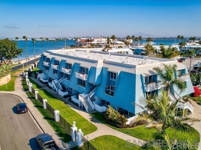 PRICE IMPROVEMENT! Stunning Upgraded Coronado Condo with Ocean, Bay & Skyline Views! Make an exciting new life in this home or take advantage of its complete furnishings to facilitate rental income. Discover light, bright coastal living in this beautifully updated 2-bed 2.5-bath, 1,492 sq ft condo adjacent to Loews Coronado Bay Resort in desirable 72-unit Montego Village. Completed Oct 2024, the renovation includes the addition of an office space with upgraded soundproofing allowing Zoom & work from home in quiet privacy. New LVP flooring, solid wood doors w/ modern hardware, dimmable LED lighting and a fresh coat of quality paint. Spacious living areas feature cozy gas fireplace, large half bath, storage and private balcony perfect for taking in CA sunsets. Updated kitchen is equipped with modern stainless-steel appliances and new KitchenAid dishwasher. Generously sized bedrooms each include ensuite bathroom and max closet & storage space. Main bedroom balcony has unobstructed west-facing ocean, bay & bridge views. Residents enjoy lush landscaping, access to Montego Village swimming pool, spa, clubhouse/rec room, and the security of a gated community. This unit includes a brand new private 2-car garage upgrade with cabinetry and electric door opener, offering secure storage of CA lifestyle accessories like surfboards & bikes. Easy access to multiple military bases and both the bike & the walking paths along San Diego Bay & Pacific Ocean, plus green spaces, playground, dog park, pickleball, tennis & basketball courts, café, boat docks & Yacht Club. Included within the Coronado Cays Community is a massive green space, soccer fields, playground, dog park, pickleball, tennis and basketball courts, restaurant, and Coronado Cays Yacht Club. Boat docks are available for rent or lease within the Coronado cays. Residents of the Coronado Cays Community enjoy dining and lodging discounts with the adjacent Loews Coronado Bay Resort. 16 Montego comes fully furnished and ready to move in or rent out!