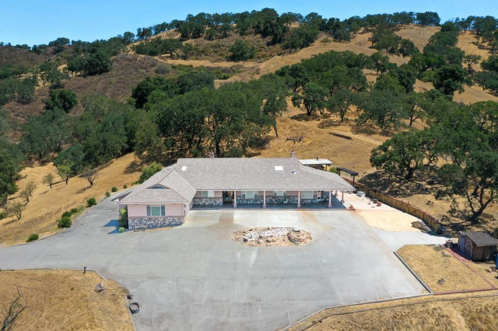 A once in a lifetime opportunity in Morgan Hill. First time for sale with an extraodinary home and one secondary dwelling! This stunning residence is nestled on approximately (9) acres of picturesque land, giving a perfect blend of privacy & confort for a large family. There is a total of (4) bedrooms that all have their own bathroom with shower. Enjoy the added convenience of a bonus room, which can be used for game room or office space. There is also (1) half bath in the hallway going to the master bedroom. This rare estate has breathtaking panoramic views with luxurious living converge. The main residence spans over 4,000 square feet with a chef type kitchen that anchors the home, with granite counters & high end appliances. The home is set for entertaining with a formal dining room and seperate family room. The patio goes around the whole house inviting you to savor the amazing views and the traquility of nature. There are endless opportunities whether it's creating your dream garden, hosting outdoor gatherings, or simply enjoying recreational activities. This gorgeous property is a fantastic retreat while still being conveniently located near local amenities like Calero Lake & Cinnabar Hills Golf Club. The property is one of the most prominent homes.